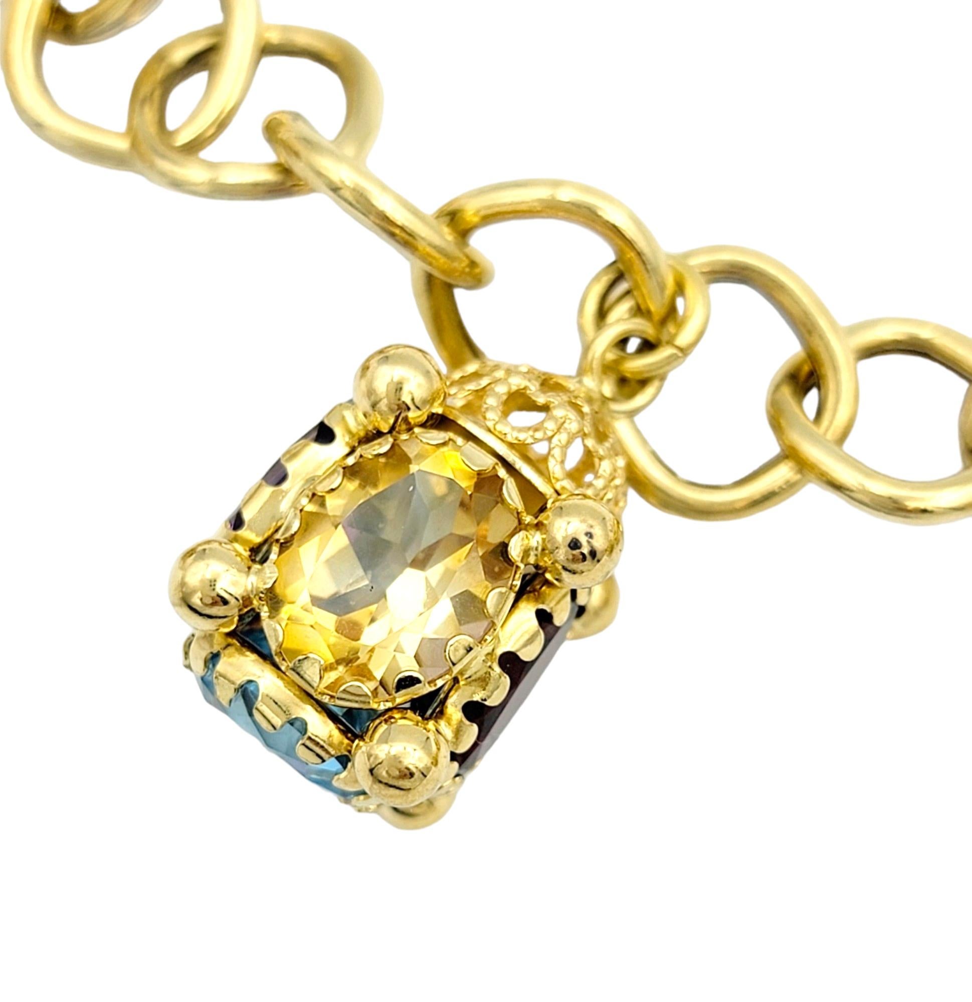 Women's Multi-Colored Gemstone Dangle Charm Bracelet Set in 18 Karat Yellow Gold For Sale