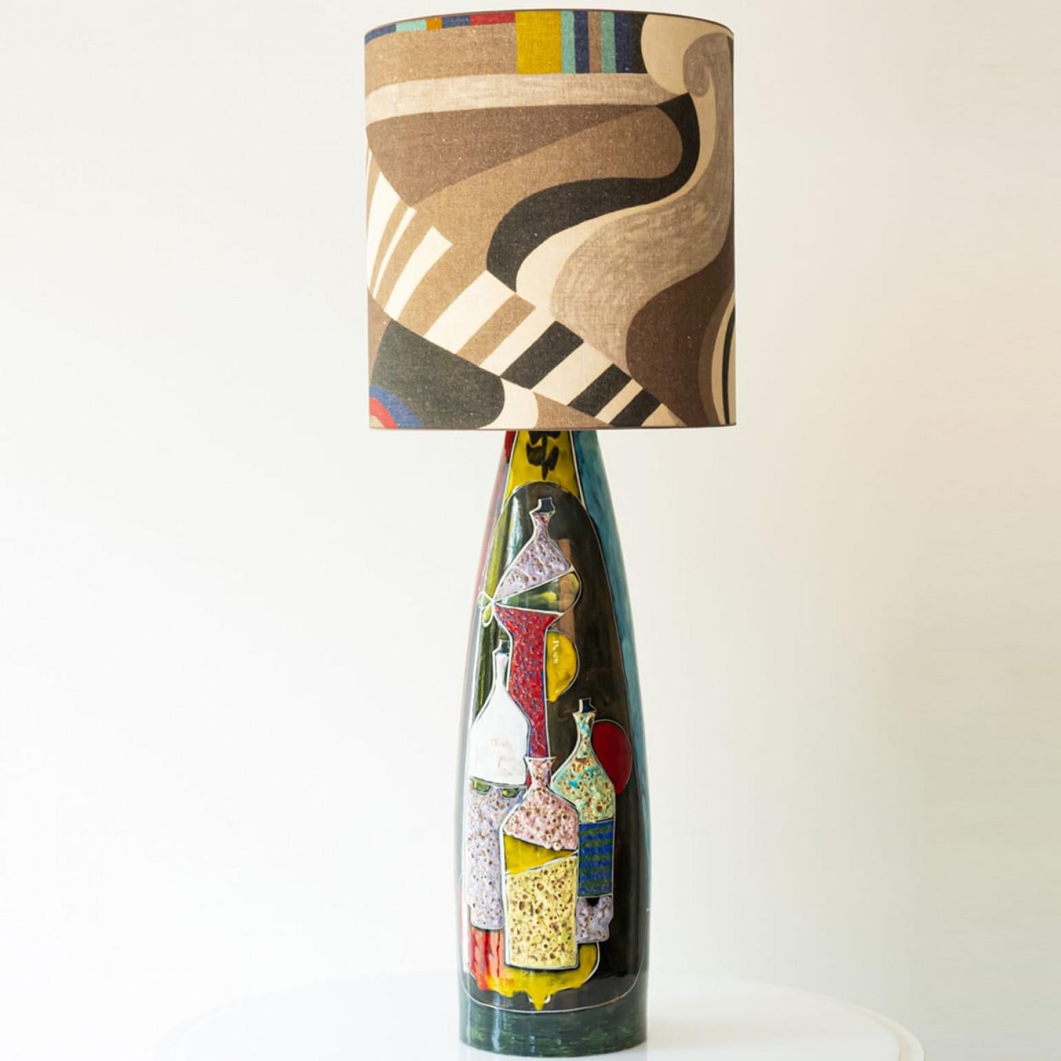 Heavy quality ceramic table or floor lamp,  1970s.

This�  lamp base brings refined elegance and rich visual appeal to any interior. With its beautiful shape, it offers a unique presence.

This multi colored glazed ceramic base (red, brown,