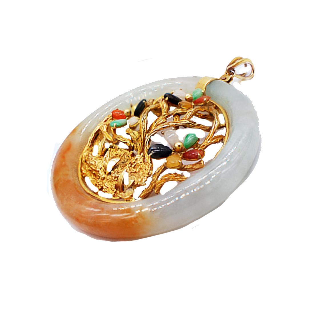 Jade Pendant Tree of Life with Gold branches and live-type colored tree canopy

14 karat yellow gold encrusted tree symbol consists of jade colors of black, green, lavender orange and brown colors. The pendant measures 2 inches in diameter and had a