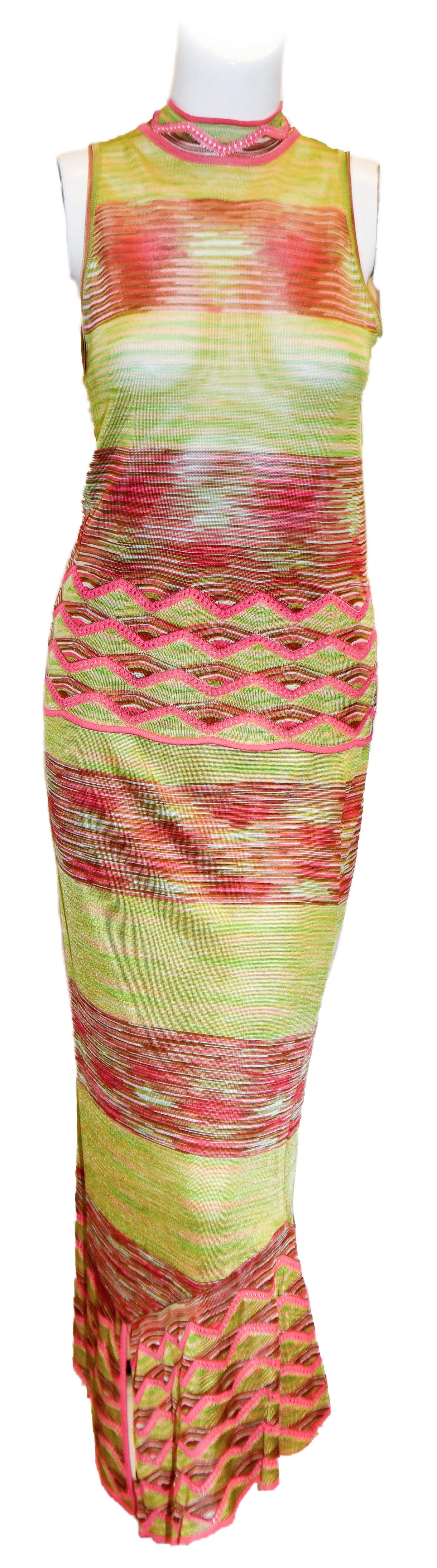 Mis  soni multi colored accentuated in chartruese and pink, 4 piece ensemble includes  a 2 piece Chevron knit 
V-neck cardigan tank top twin set. This flirty set, also includes a long skirt that is open at front on the hem and, also, a long scarf. 