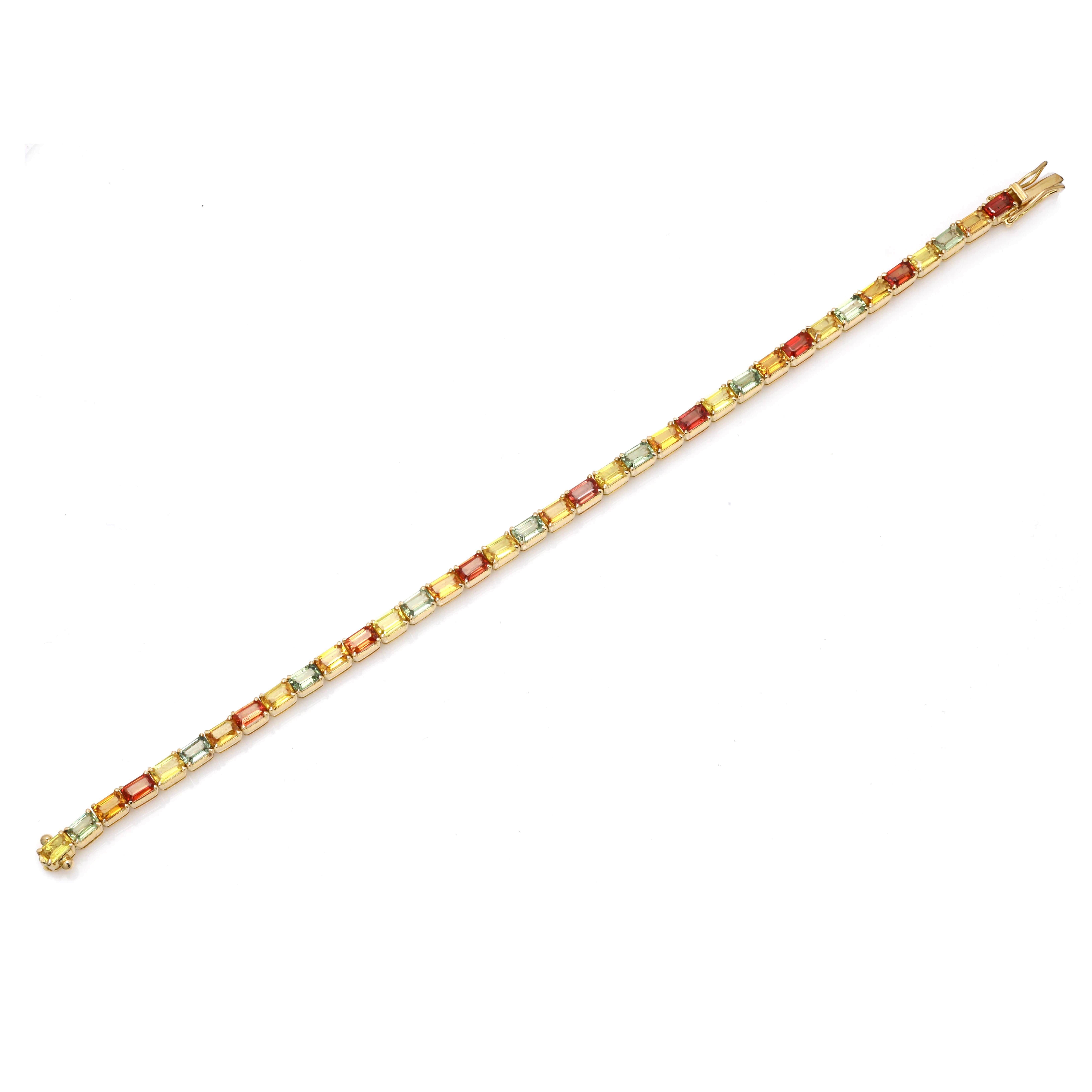 This Handcrafted Multi Colored Sapphire Tennis Bracelet in 18K gold showcases 36 endlessly sparkling natural sapphires, weighing 12.25 carat. It measures 7.75 inches long in length.
Sapphire stimulates concentration and reduces stress. 
Designed