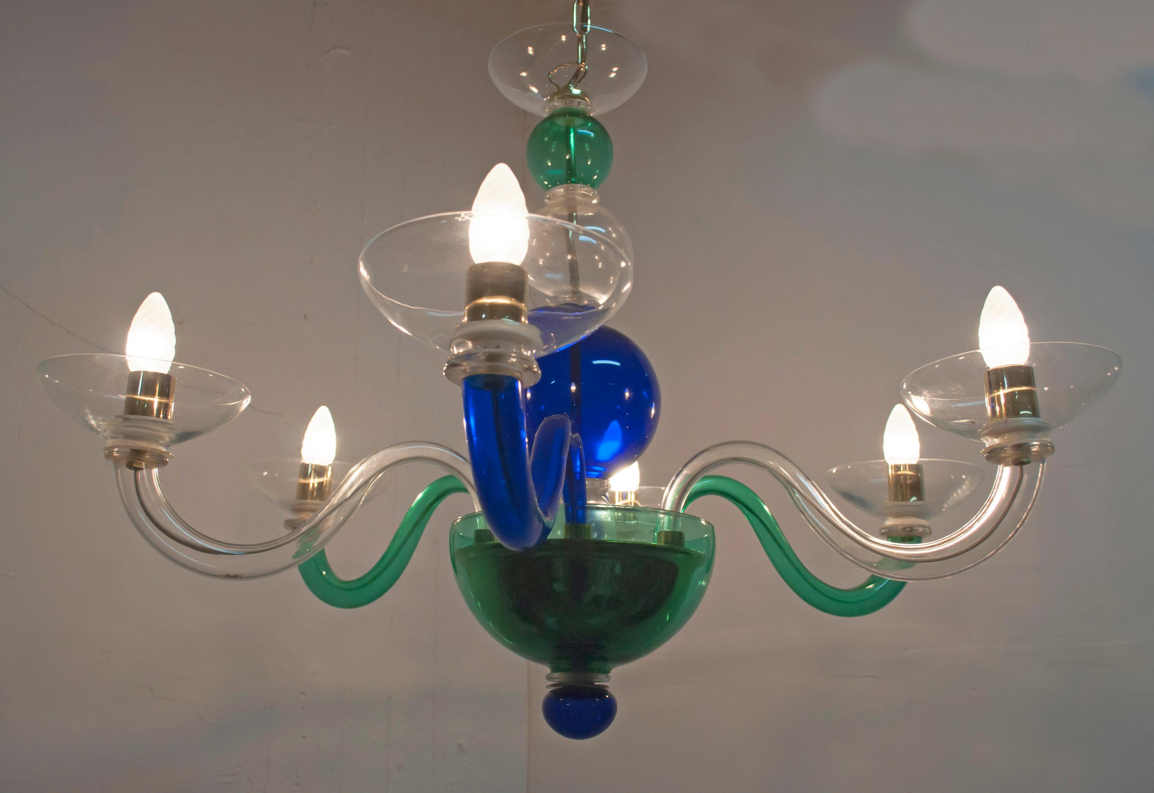 Multicolored Postmodern chandelier with six lights.
Produced by the historic Muranese company Sylcom in the 1990s
Handcrafted workmanship with mouth-blown glass.