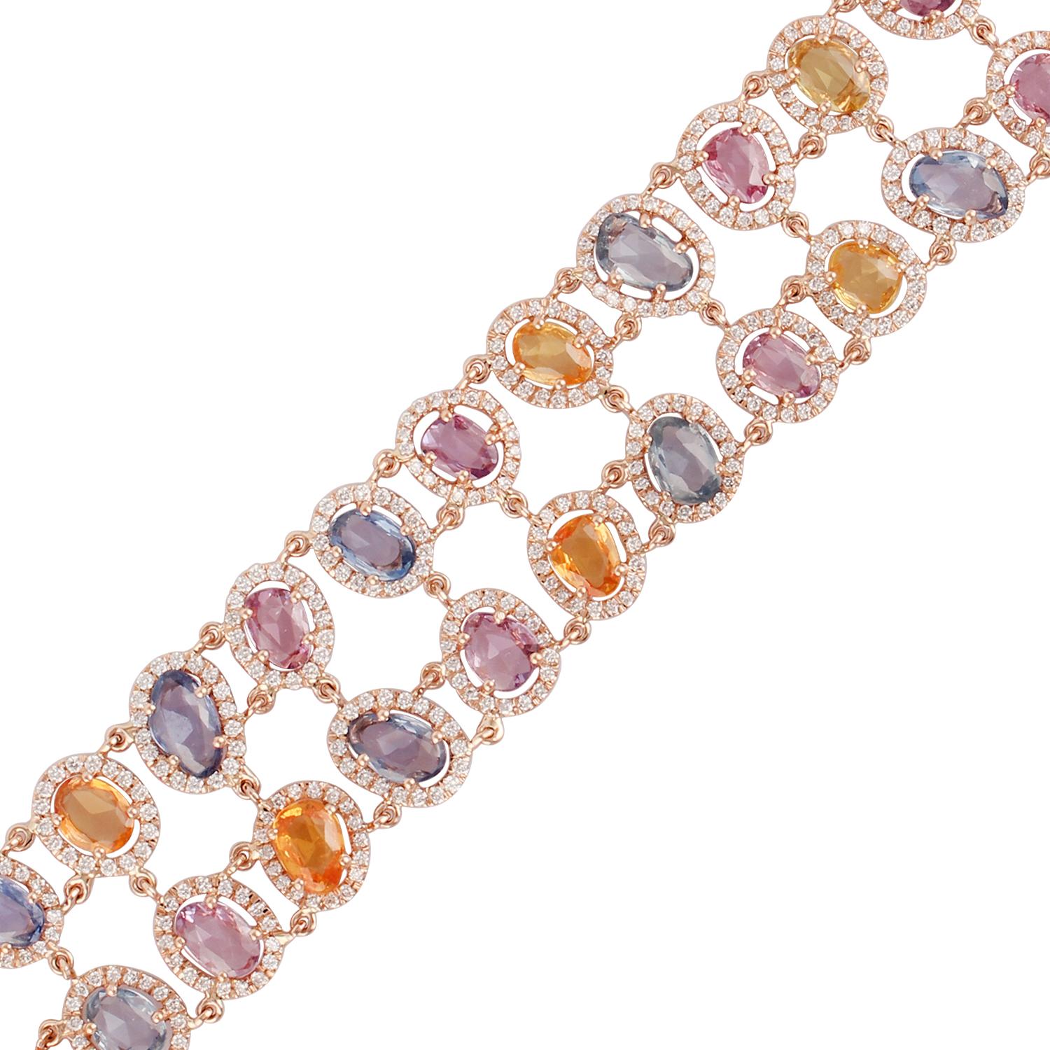 Full-cut Round Diamonds 3.70 carats
Multi-colored Rose-cut Uneven shaped Sapphires 19.65 carats
18 kt Rose gold 20.75 grams
The bracelet has an easy 'press and pull' lock mechanism for opening and also has safety clasp beneath the lock.
