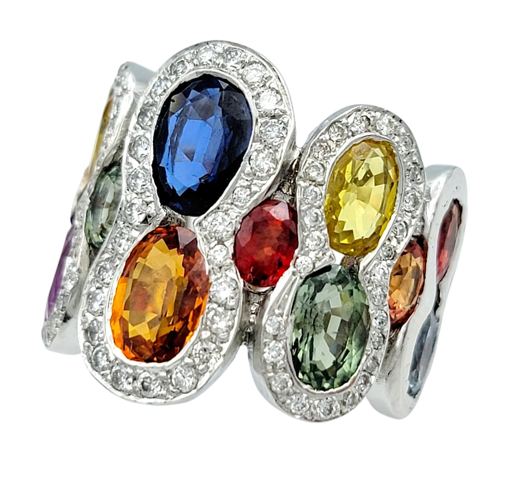 Oval Cut Multi-Colored Sapphire and Pavé Diamond Wide Band Ring in 18 Karat White Gold For Sale