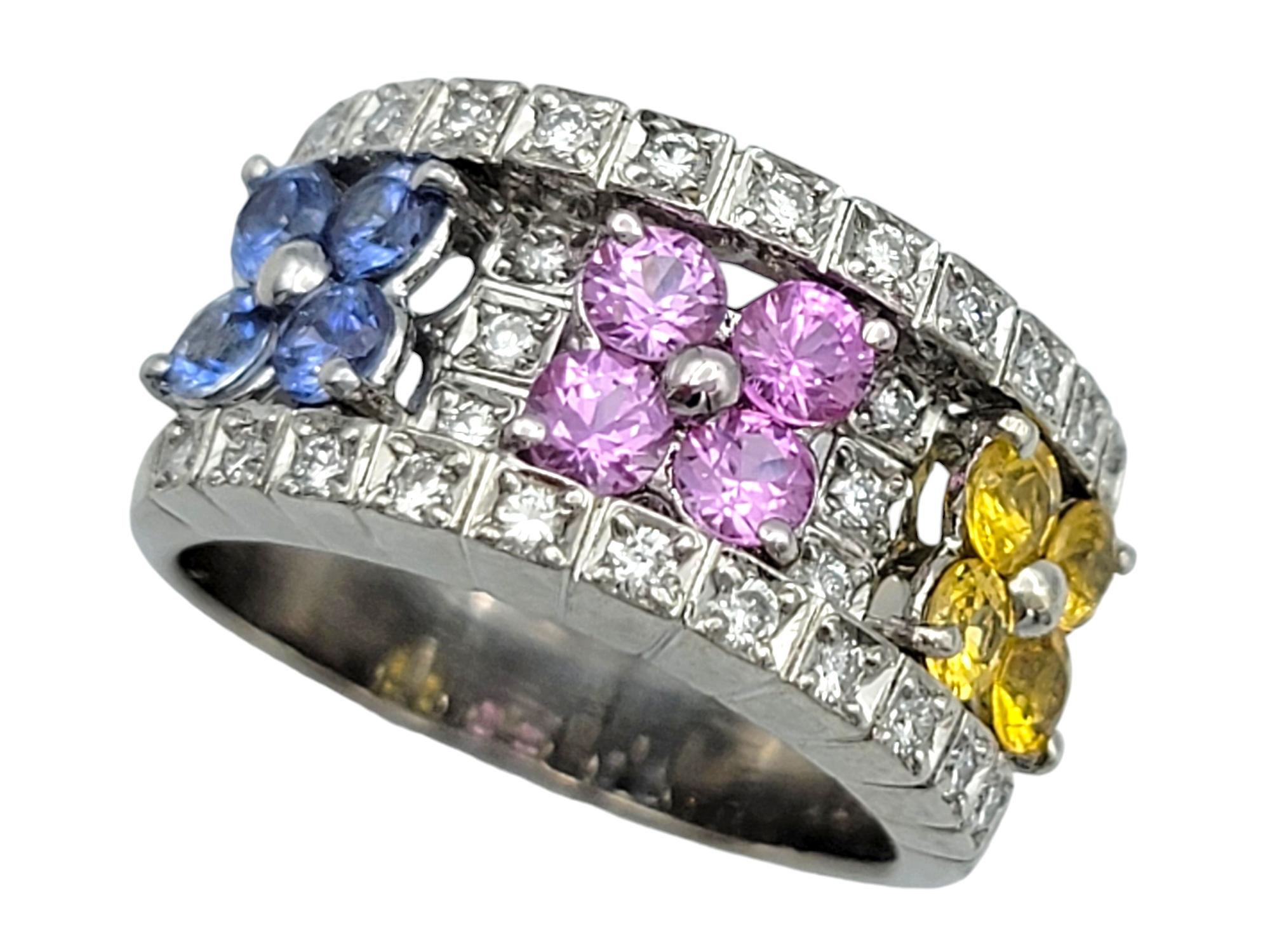 Ring Size: 4.5

Introducing this wonderfully colorful and shimmering band ring, masterfully crafted in 18 karat white gold. Elegance meets artistry in this truly captivating design. This stunning ring features blue, purple and yellow sapphires set