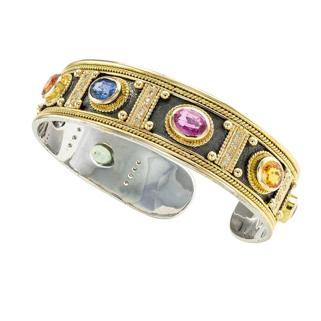 Multi-colored sapphires and diamond architectural cuff bracelet circa 1990. *

ABOUT THIS ITEM:  #B-DJ126E. Scroll down for specifications. The architectural style bracelet features an impressive display of bezel-set sapphires, all in different