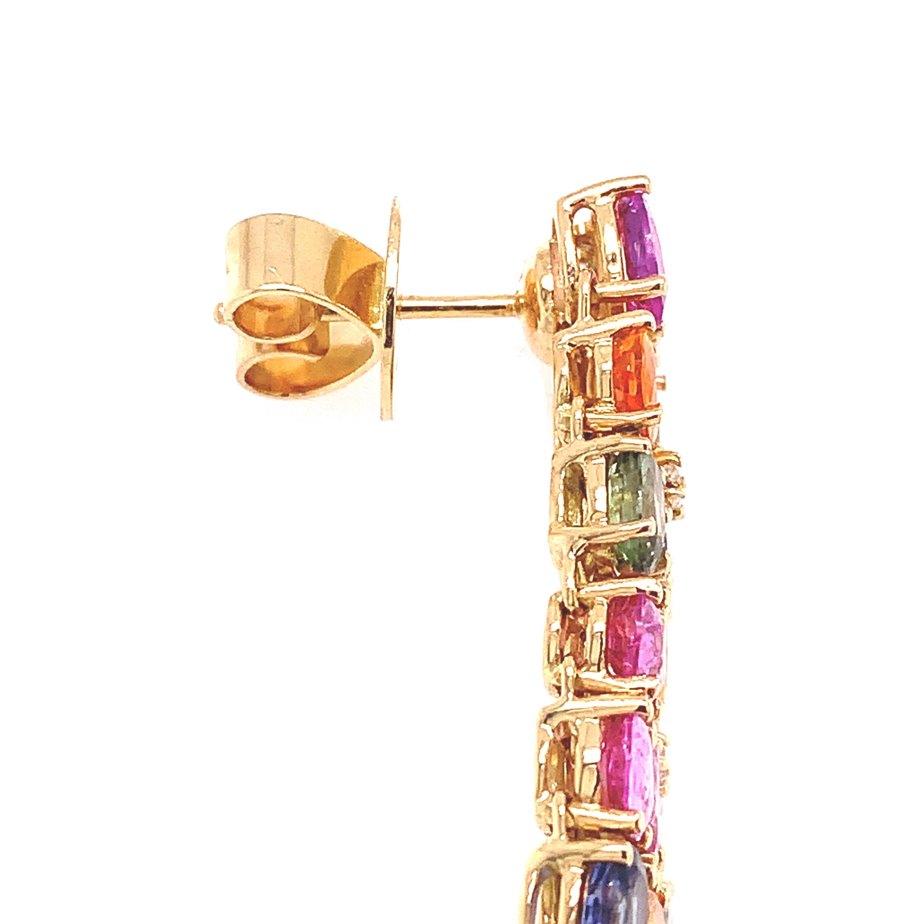 Rainbow Collection 

In an opulent ode to color and radiance this earring combines Oval and Trapezoid Cut Multi-colored sapphires totaling 14.69 carats and dazzles with gently scattered Diamonds 