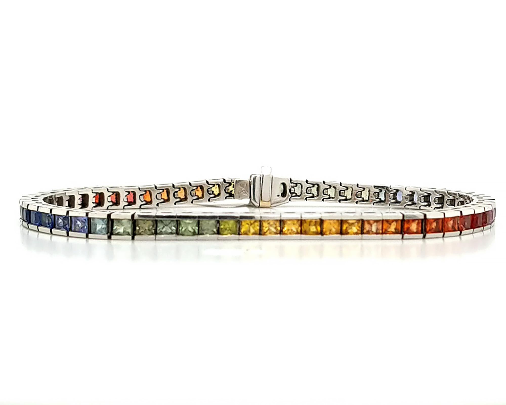 A beautiful tennis bracelet embellished with multi-colored princess-cut sapphires. Total weight of sapphires is 9.47 carats.
Made in 18K white gold weighing 20.90 grams.
Length of bracelet is 7 1/3 inches (18.7 cm).