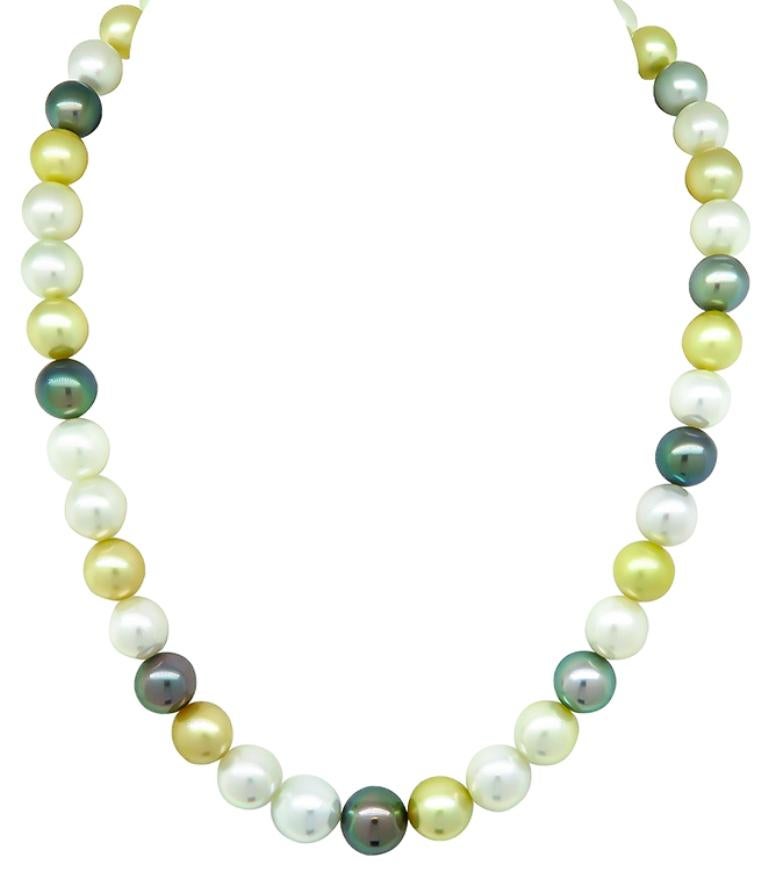 This necklace features a graduated single strand of multi color south sea pearl that measures from 9mm to 11mm. These wonderful gems of the ocean features an amazing silver ball clasp. The necklace measures 17 inches in length and weighs 59.9