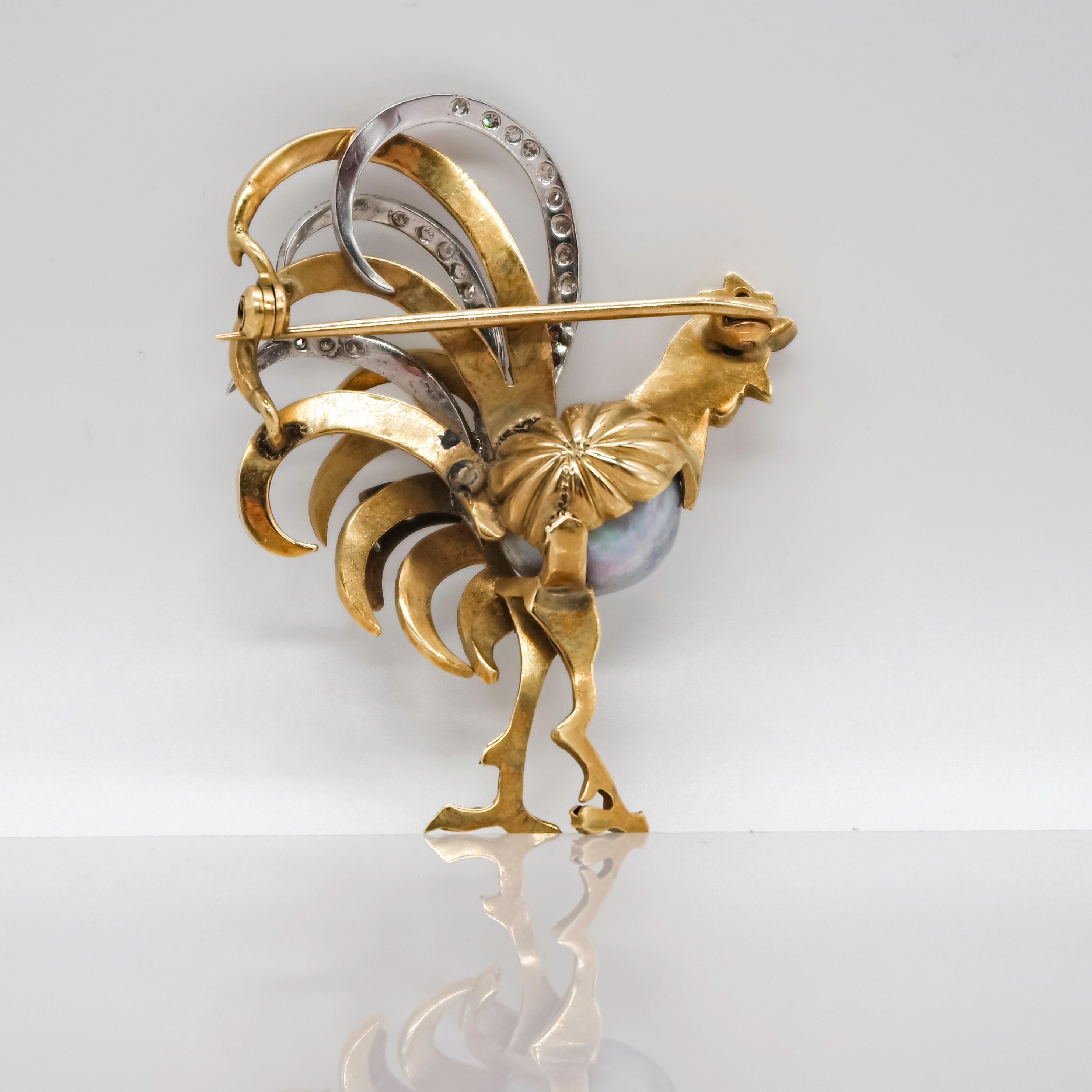 This brooch from the fifties, is a wonderful representation of a rooster thanks to a wondeful use of different techniques and materials. The baroque  tahitian pearl is the body, while all the figure of the hooster is developped in 18 karat yellow