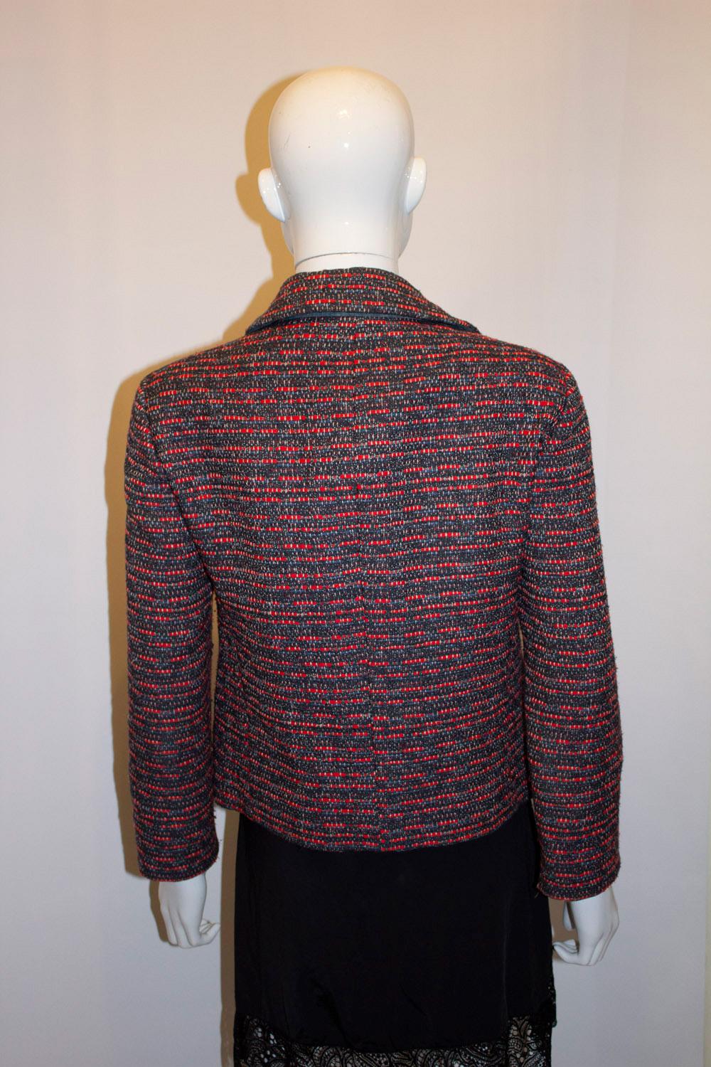 A great jacket for Fall by Marc Jacobs, Marc line. In a red , grey , lilac and blue mix called Cambridge Red fabric, the jacket has a round collar and  4 button opening and two pockets. It is fully lined.  Size M Bust up to 38'', length 21''