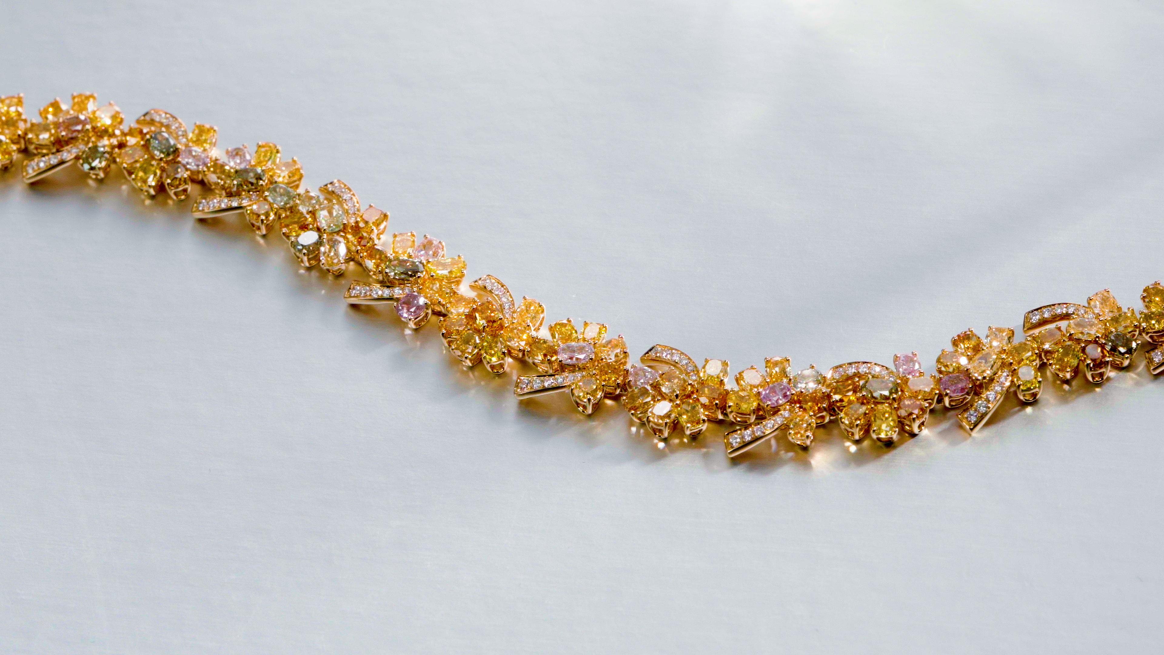 Contemporary Multi-coloured natural fancy diamond bracelet with mixed shape diamonds in 18KT For Sale