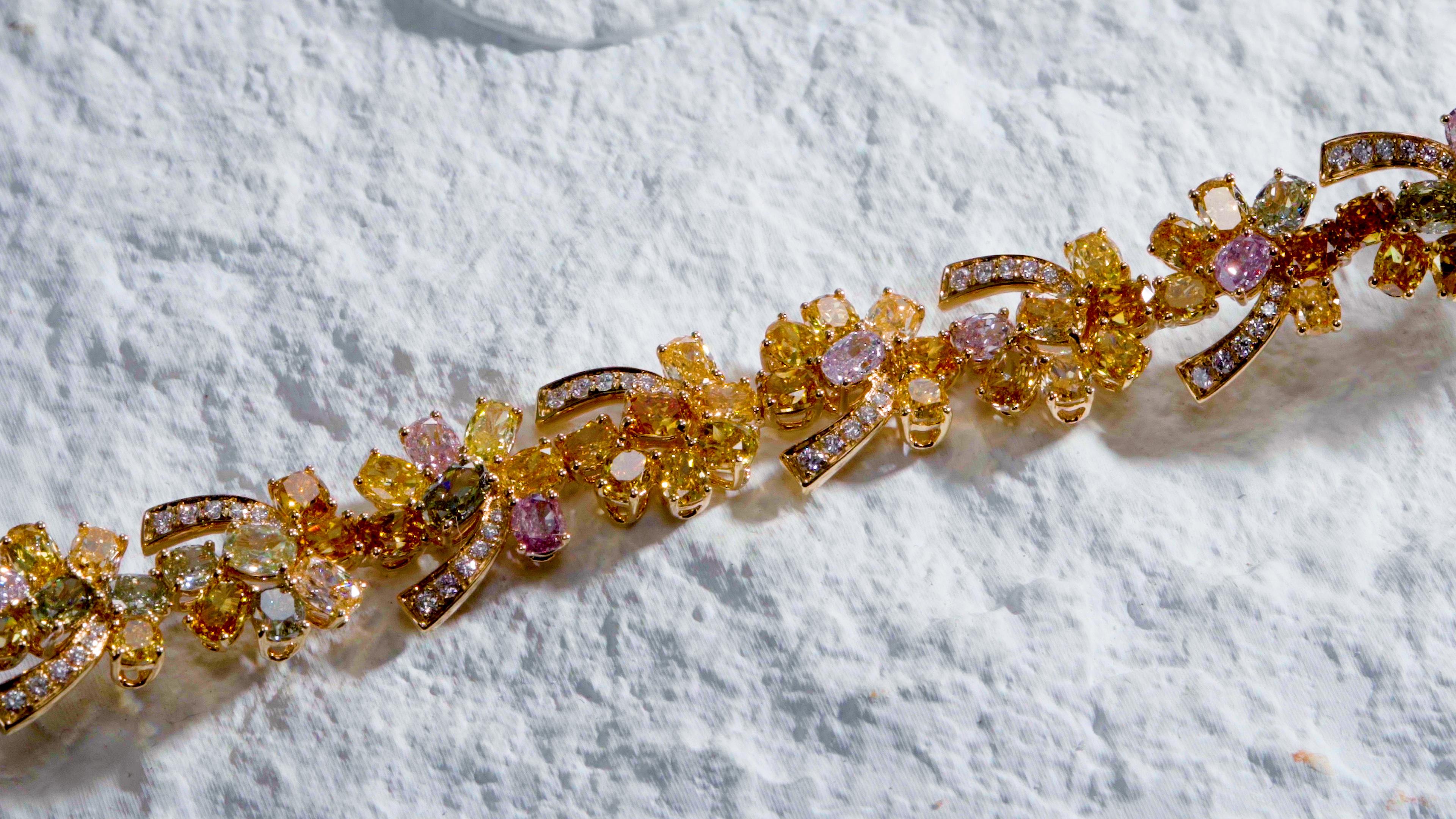 Cushion Cut Multi-coloured natural fancy diamond bracelet with mixed shape diamonds in 18KT