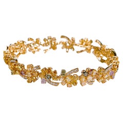 Multi-coloured natural fancy diamond bracelet with mixed shape diamonds in 18KT