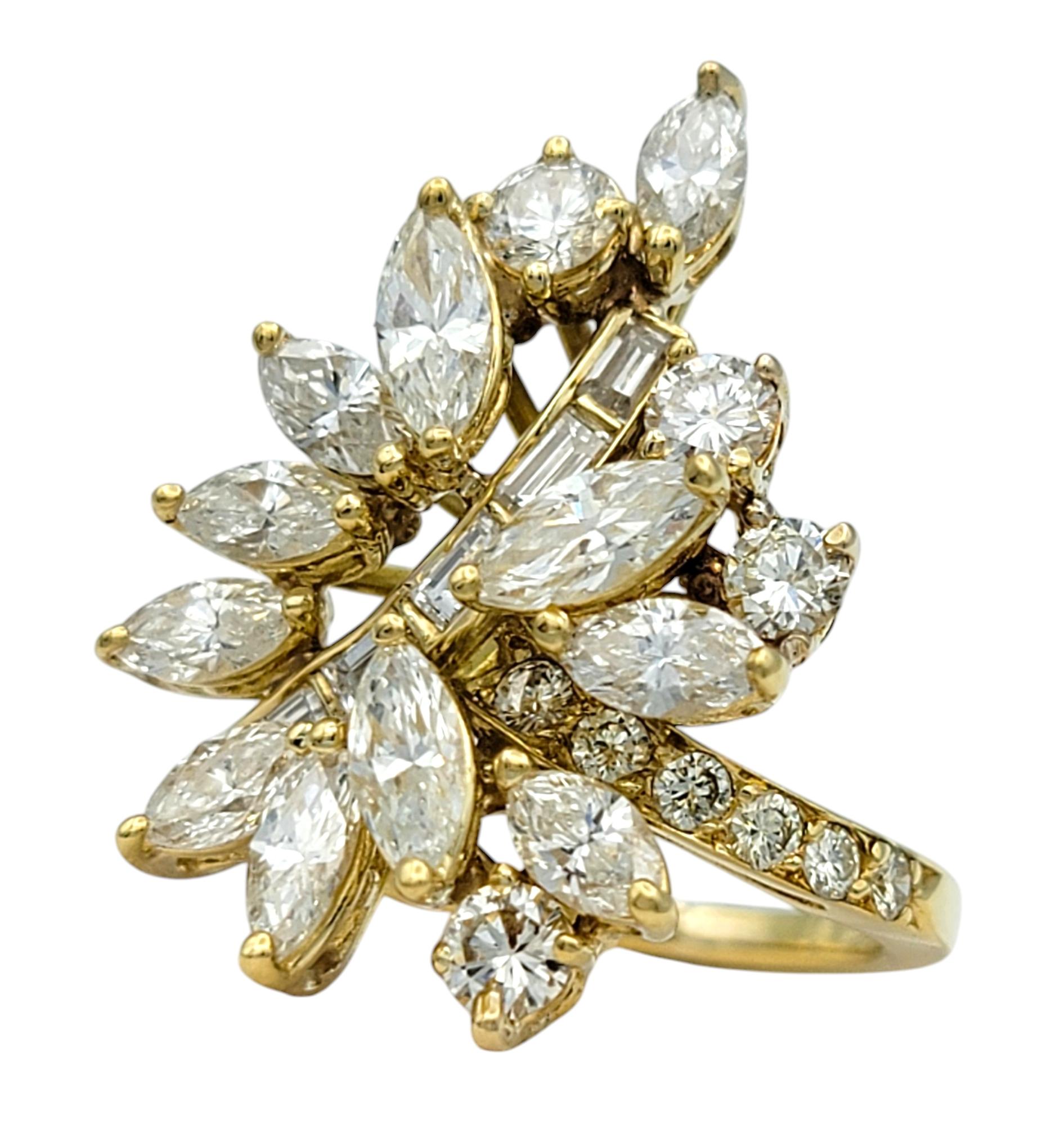 Ring Size: 4.25

This exquisite diamond cluster ring is a dazzling display of brilliance and artistry, designed to captivate from every angle. Featuring an array of multi-shaped diamonds—round, marquise, and baguette cuts—this stunning piece