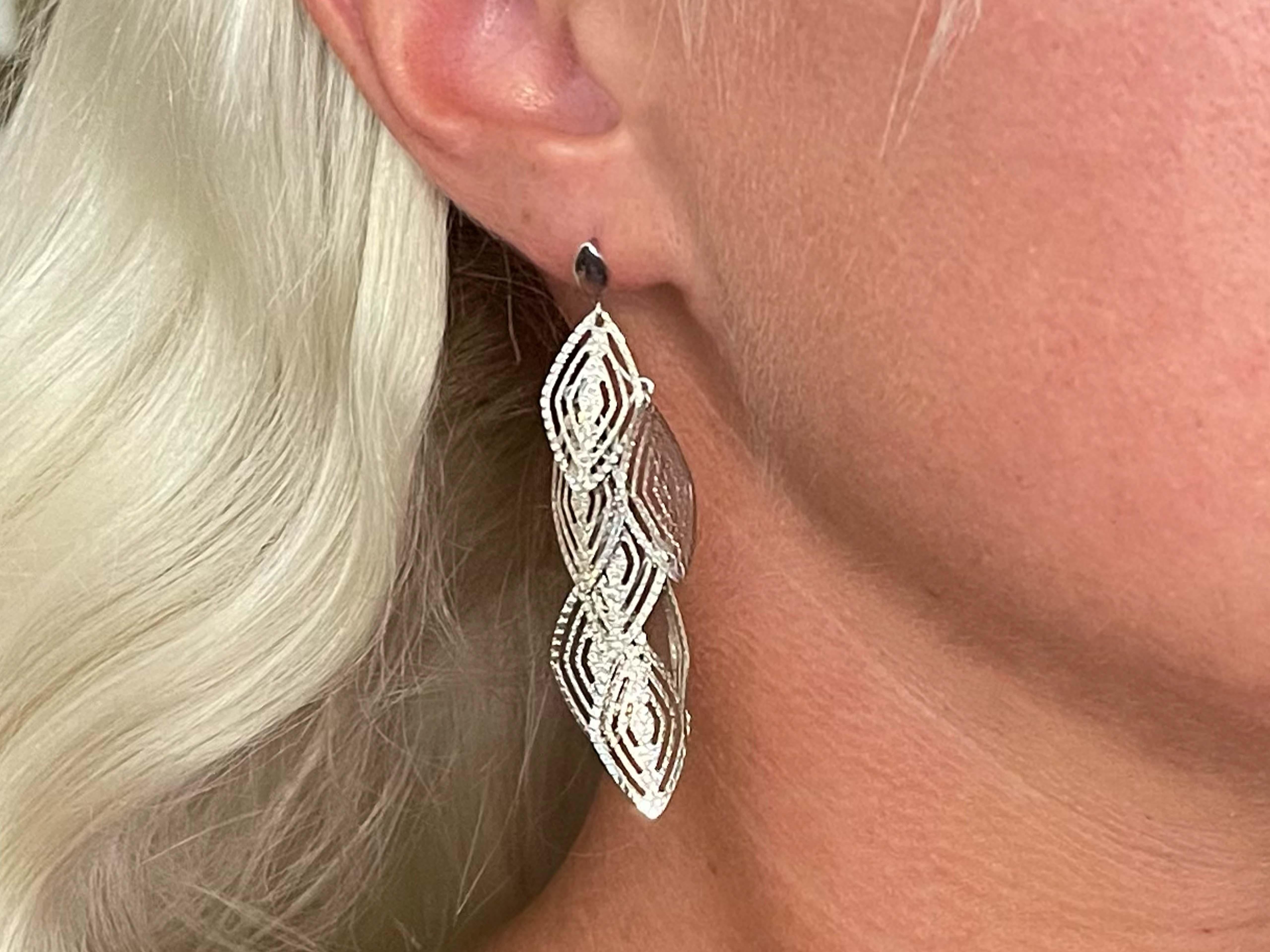 Multi Diamond Shape Dangle Earrings in 14k White Gold. Exquisite and rare, these textured earrings have an elegant sparkle as they catch light. Charming and delicate, perfect to wear on any occasion. They consist of 7 diamond shape plates suspended