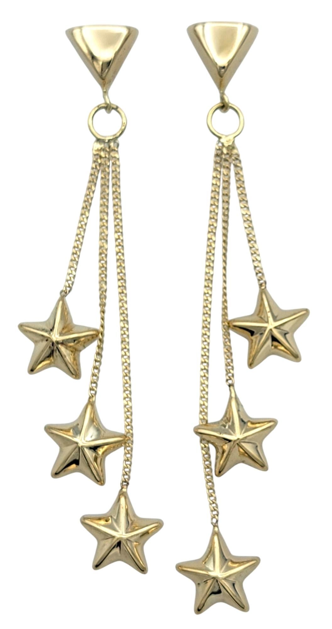 Contemporary Multi-Dimensional Star Trio Tiered Dangle Earrings in 14 Karat Yellow Gold For Sale