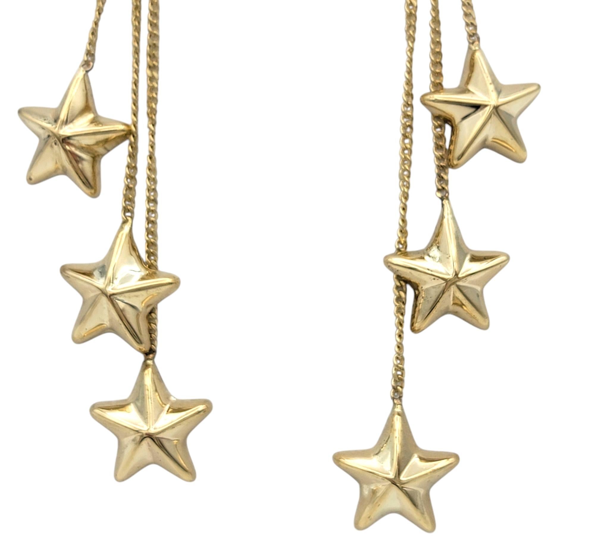 Women's Multi-Dimensional Star Trio Tiered Dangle Earrings in 14 Karat Yellow Gold For Sale