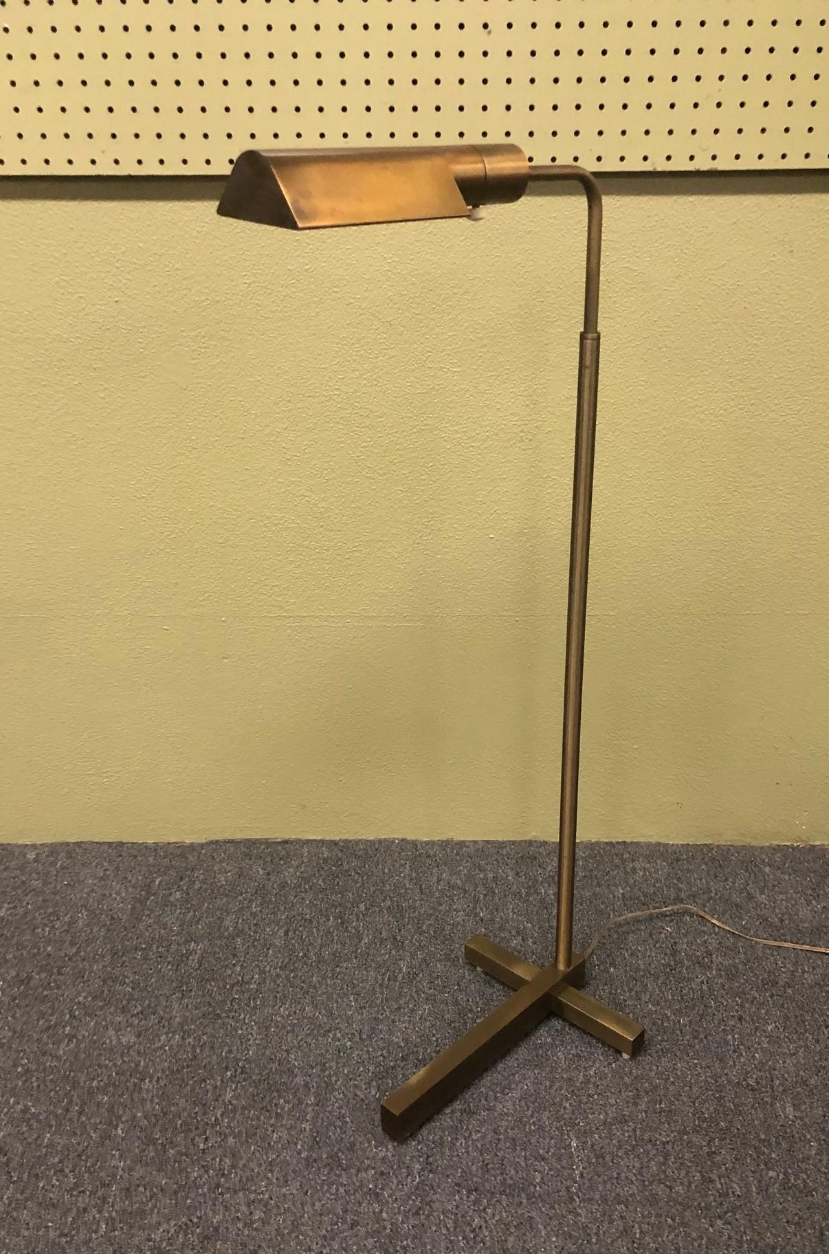 Elegant multi-directional brass floor lamp by Casella Lighting of San Francisco, circa 1960s. The main lamp pole moves up and down (from 36' to 48