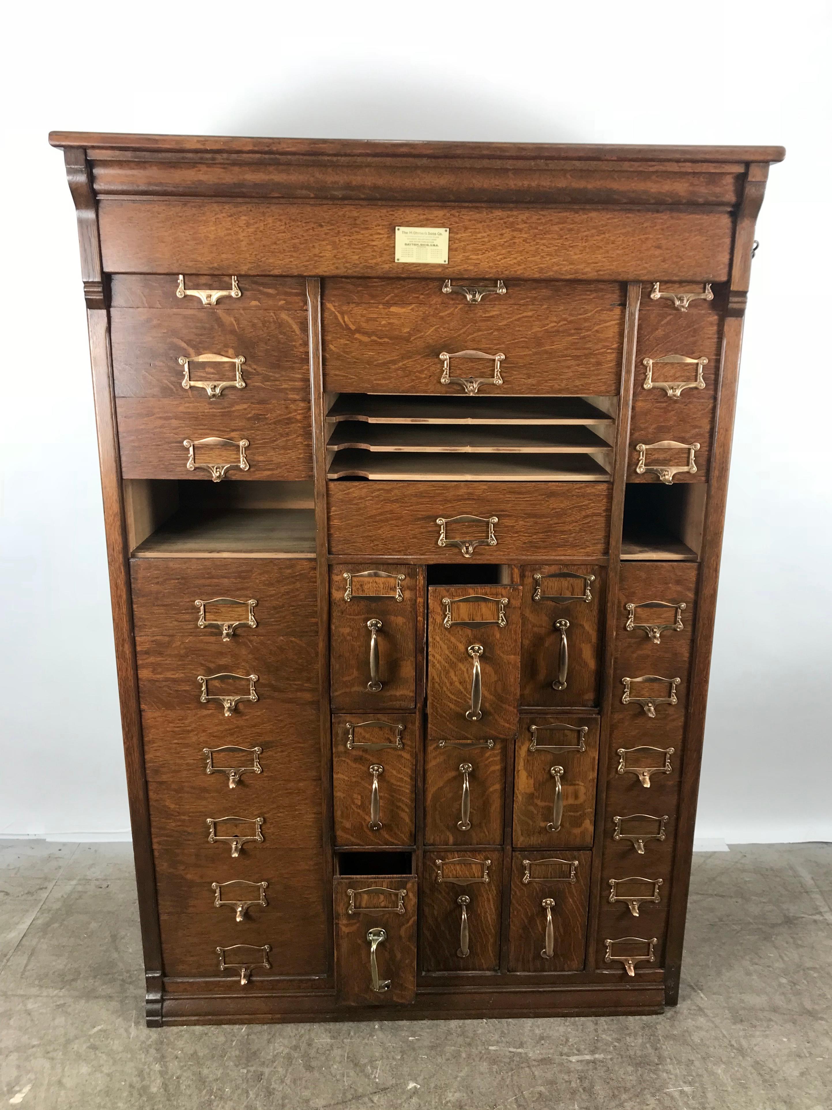 Stunning turn of the century 30-drawer antique oak cabinet made by The M.Onmer's Sons Co. Professionally restored, refinished, polished out brass hardware. Very functional, business files, card files, flat documents etc. Hand delivery avail to New