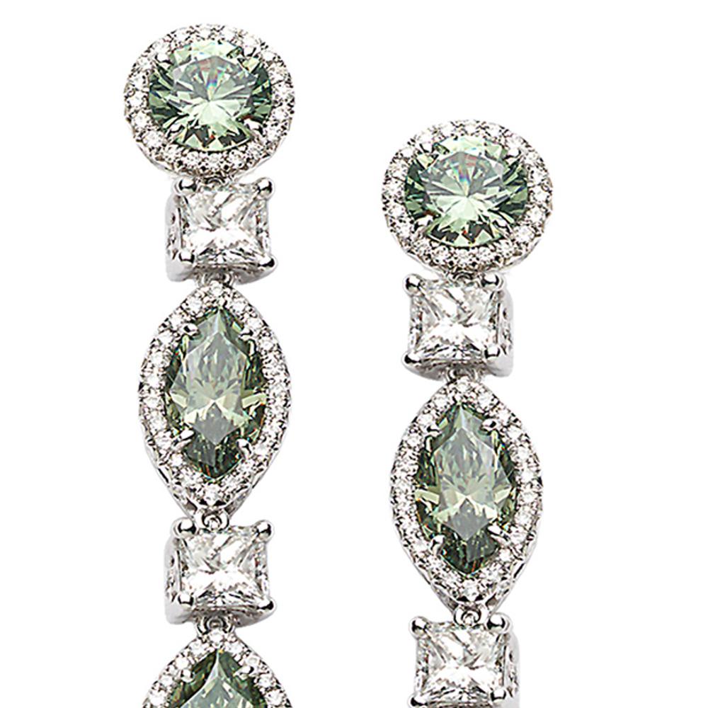 Multi-Drop Earring Set in Platinum with 7.64-carat Demantoid Garnet and 2.99-carat Diamonds. This is part of our Trinity Collection which focuses on the holy Ganges River in India and represented Trinity. This collection gains inspiration from the