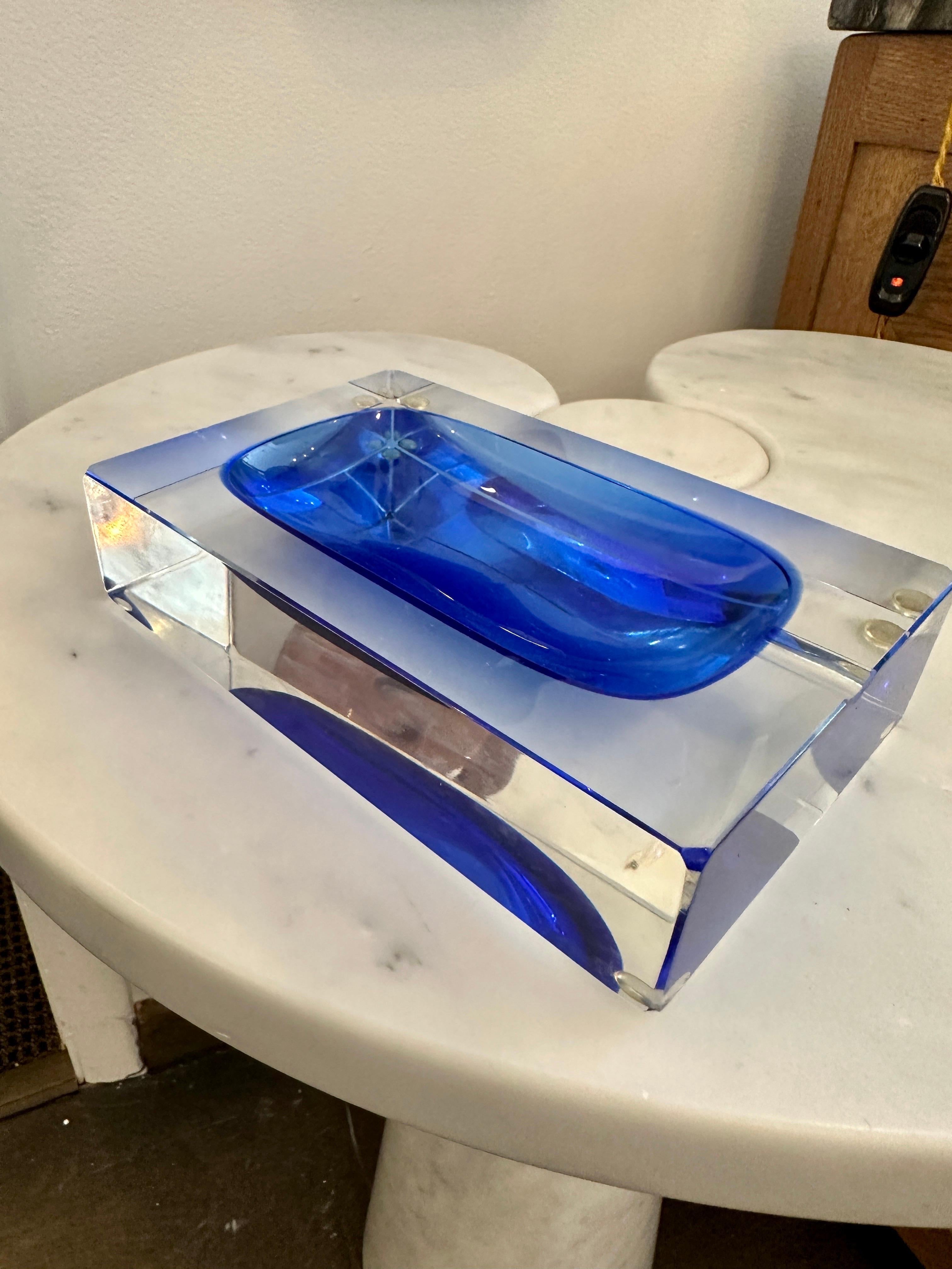 Multifaceted blue and clear Murano glass ashtray attributed to Flavio Poli.  Highly decorative rectangular table-top piece.  THIS ITEM IS LOCATED AND WILL SHIP FROM OUR EAST HAMPTON, NY SHOWROOM.