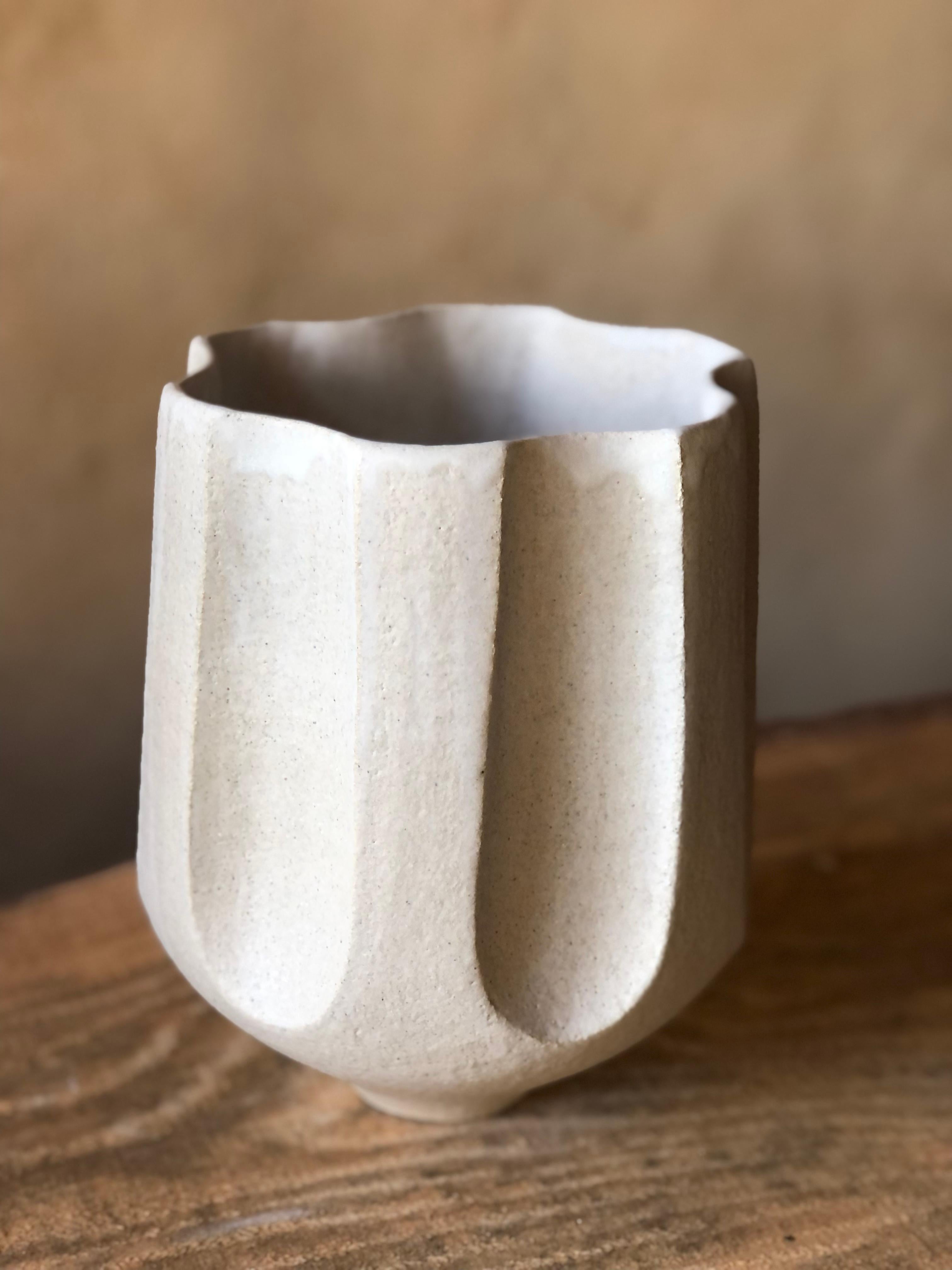 Multi Facetted Vase With White Crackle Glaze by Sophie Vaidie
One Of A Kind.
Dimensions: Ø 18 x H 24 cm. 
Materials: Stoneware with white mat glaze.

In the beginning, there was a need to make, with the hands, the touch, the senses. Then came the