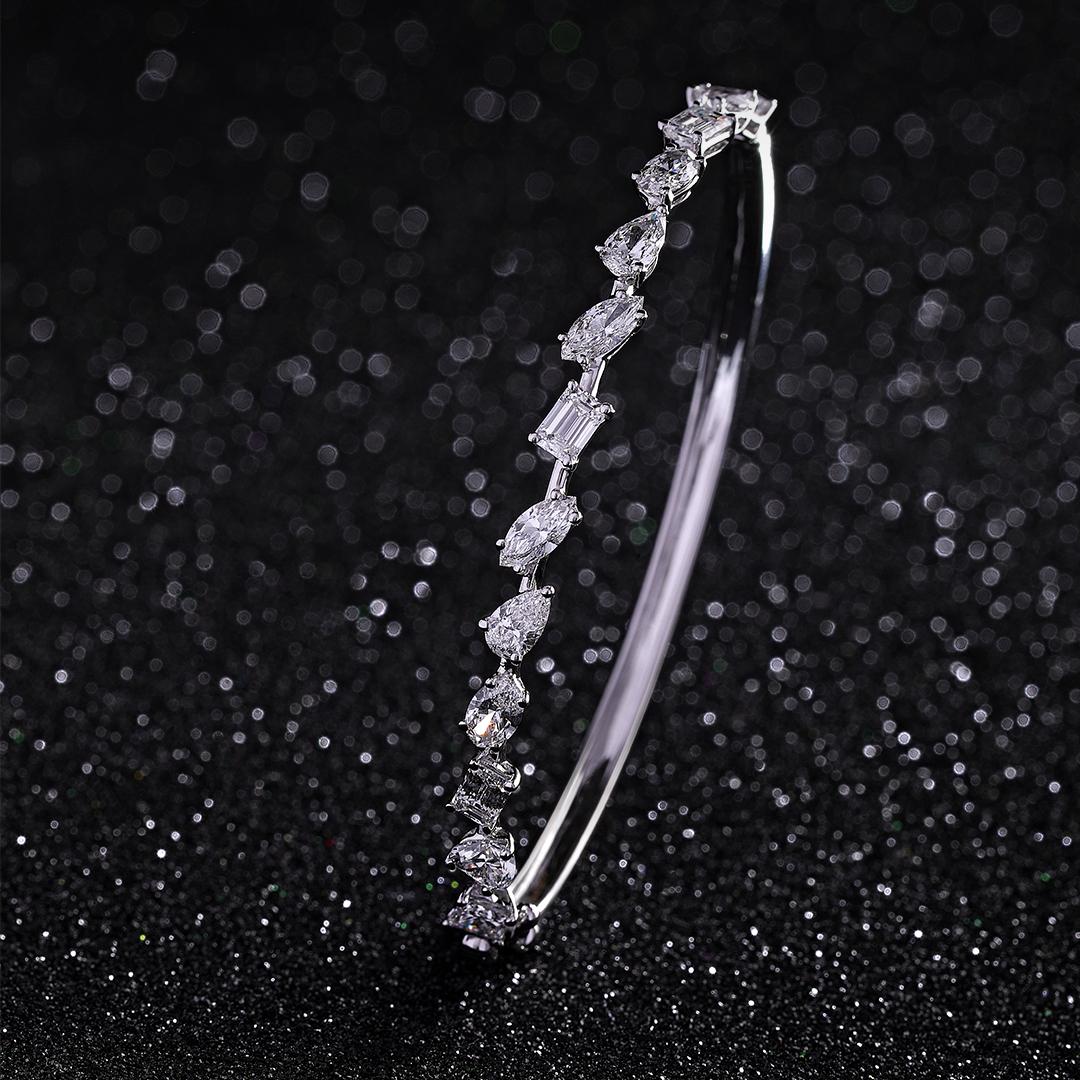 Magnificence in one line. Crafted with beautiful marquise, pear, emerald, oval, heart & princess cut diamonds, our Grace diamond bracelet symbolises the greater things in life. Set in 18kt white gold.

IGI CERTIFIED

Gold- 8.57 gms
Diamond- 4.07