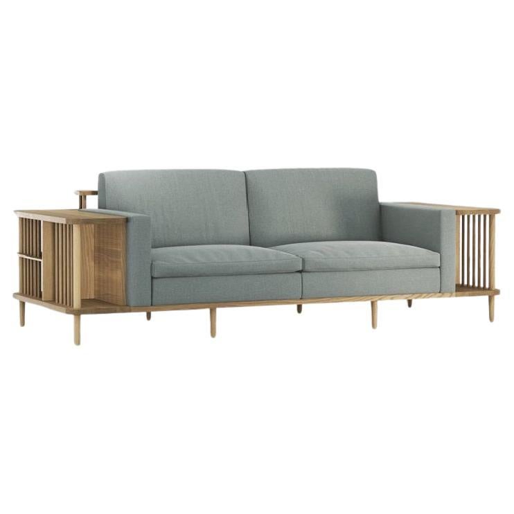 Crafted from premium materials, this sofa offers both comfort and functionality with its surrounding wooden frame doubling as a bookshelf or room divider, showcasing exquisite craftsmanship.
The focal point of this sofa is its 100% solid wood
