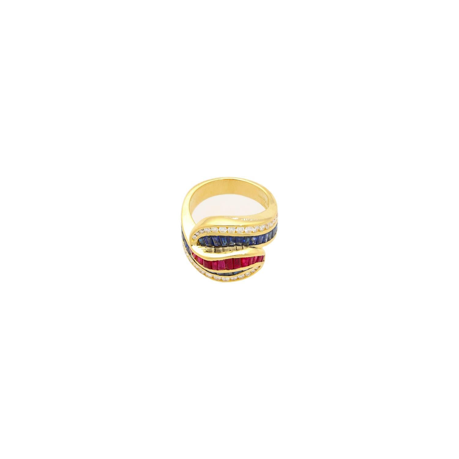 Vintage multi-gem ring, crafted in 18k yellow gold weighing 12.97 grams. Totaling carat weight is 3.00 CTTW, and is a clustered blend of fourteen red baguette-cut rubies and 28 blue sapphires, further adorned by thirty round-cut diamonds. Each stone