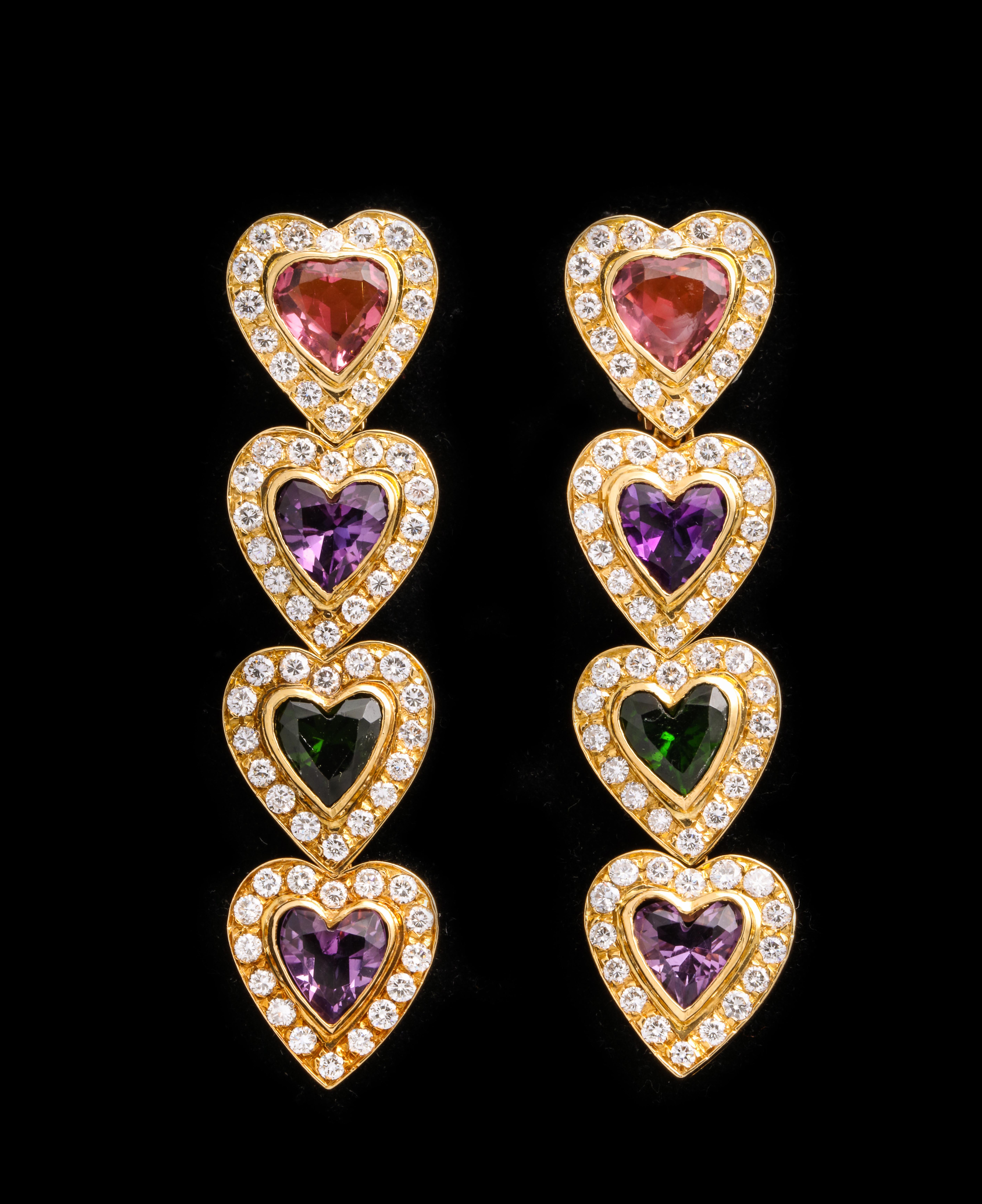 Multi Colored Sapphire Heart Earrings

Set with pink tourmaline, amethyst, and garnet

Approx 5.65 ct diamonds
18k yellow gold