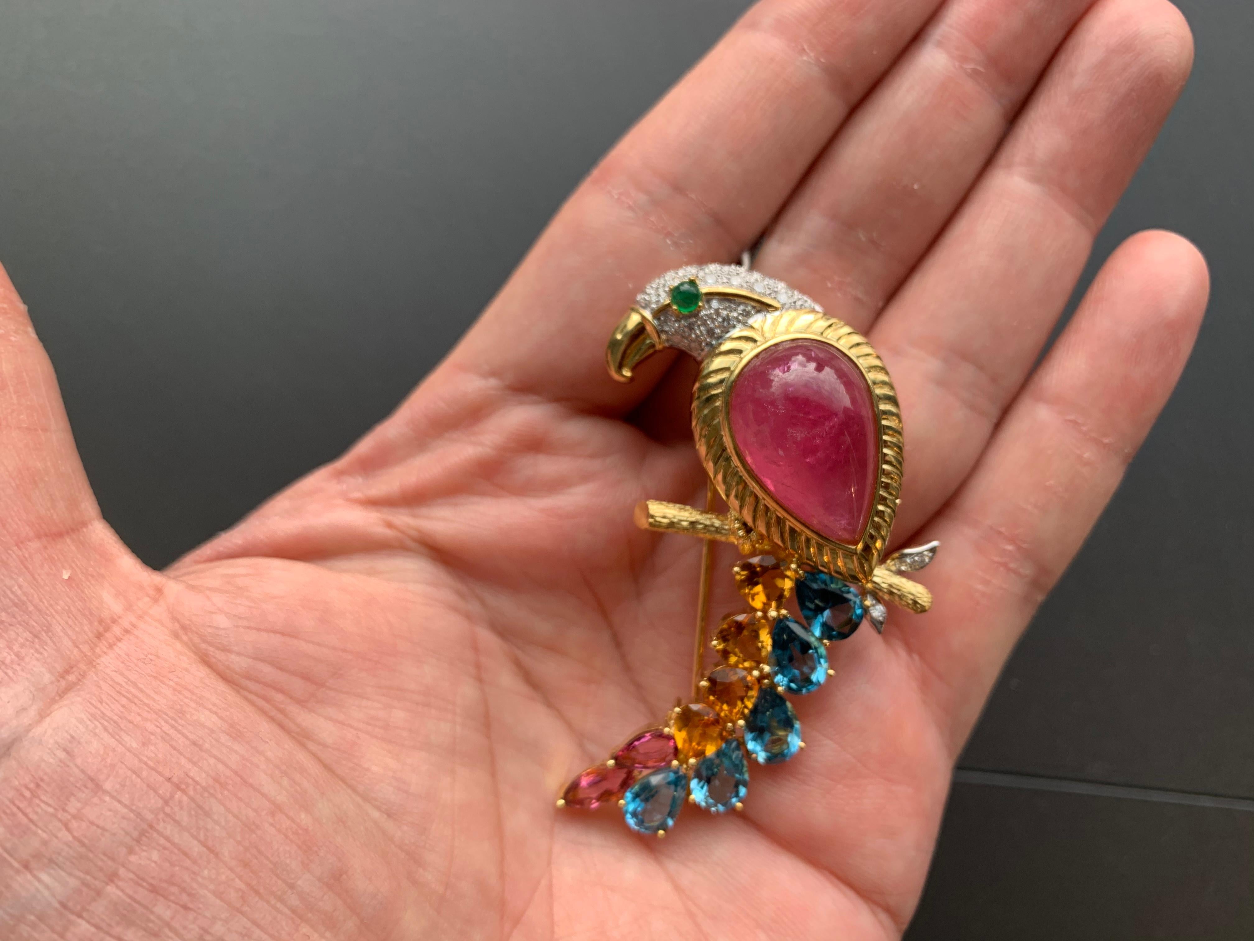Multi Gem Bird of Paradise Brooch

Cabochon Pink Tourmaline approx 15.3 ct
Further set with diamonds, citrines, topaz, and two faceted pink tourmaline
18 karat gold
circa 1980