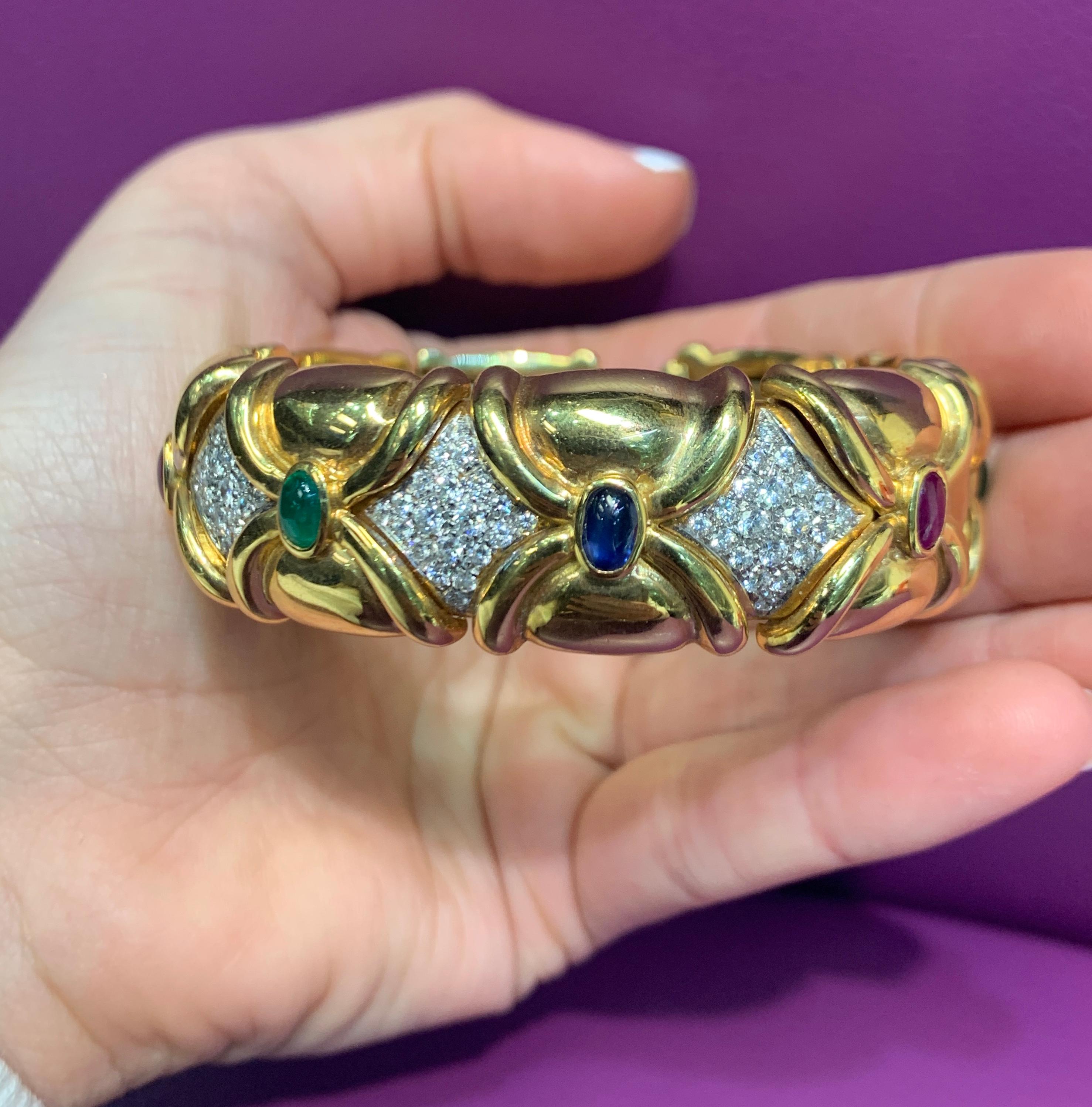 Multi Gem & Diamond Bangle Bracelet 
Cabochon stones consisting of  3 emeralds, 3 sapphires & 2 rubies 
60 pave diamonds weigh approximately 3 carats
Measurements: 2.0