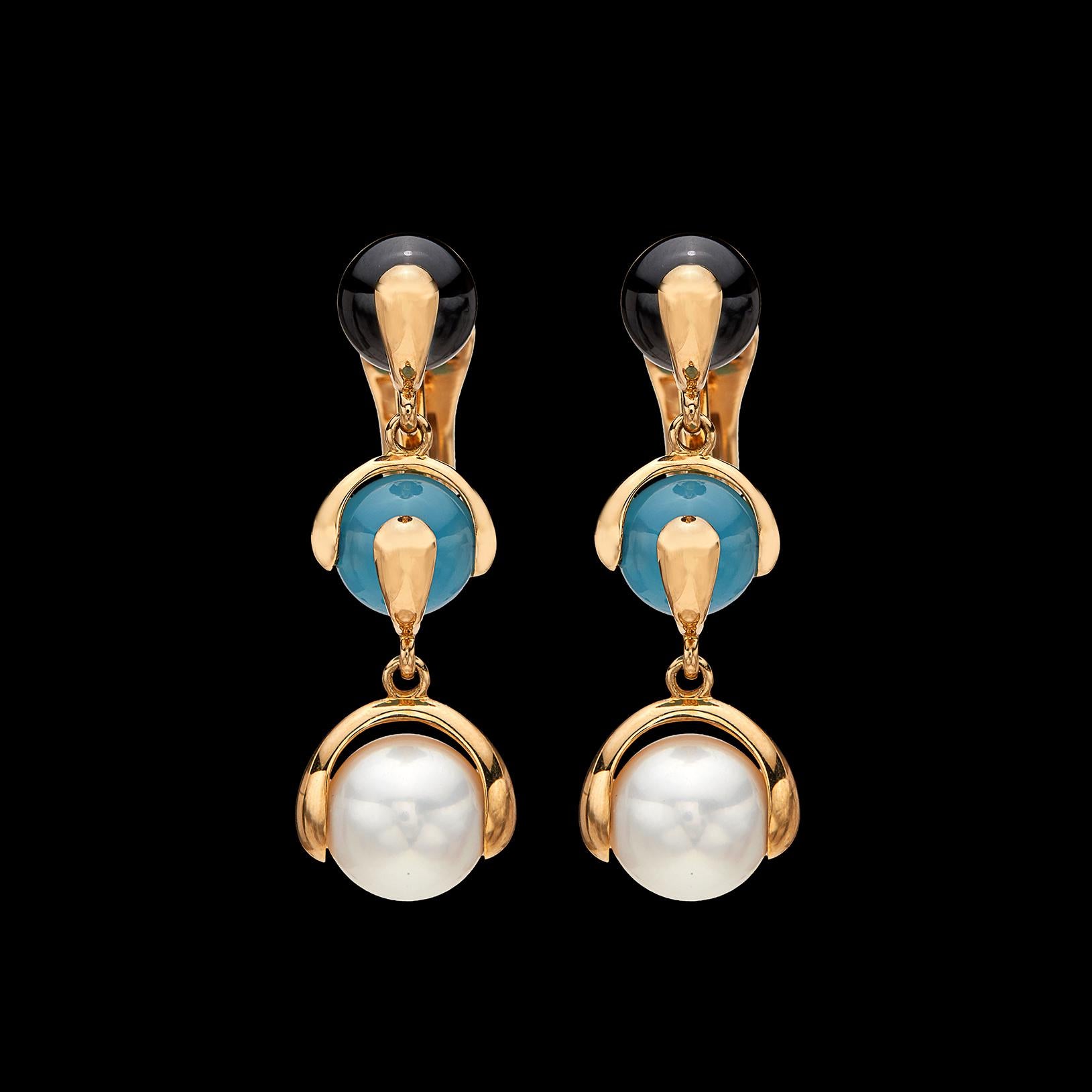 Playful and bold earrings by famed Italian designer Marina B. of the one and only Bulgari family. The 18k gold drop earrings are designed with 9.5mm cultured pearls, together with blue chalcedony and black spinel beads, and will brighten any outfit.