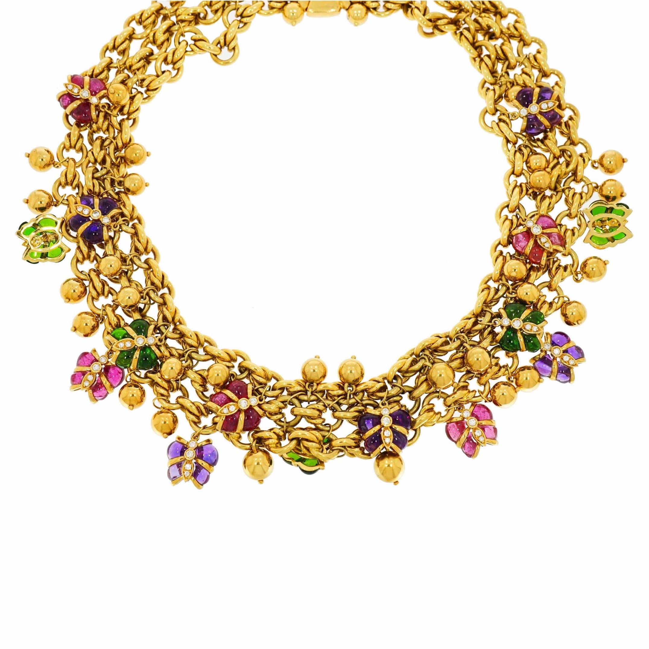 A gorgeous statement necklace!!! 
Beautifully handcrafted in 18k Yellow Gold, a triple strand of round links necklace featuring drops of multi-gem butterflies with Diamond accents. 
Just a delightful, fun and colorful piece of jewelry with cabochon