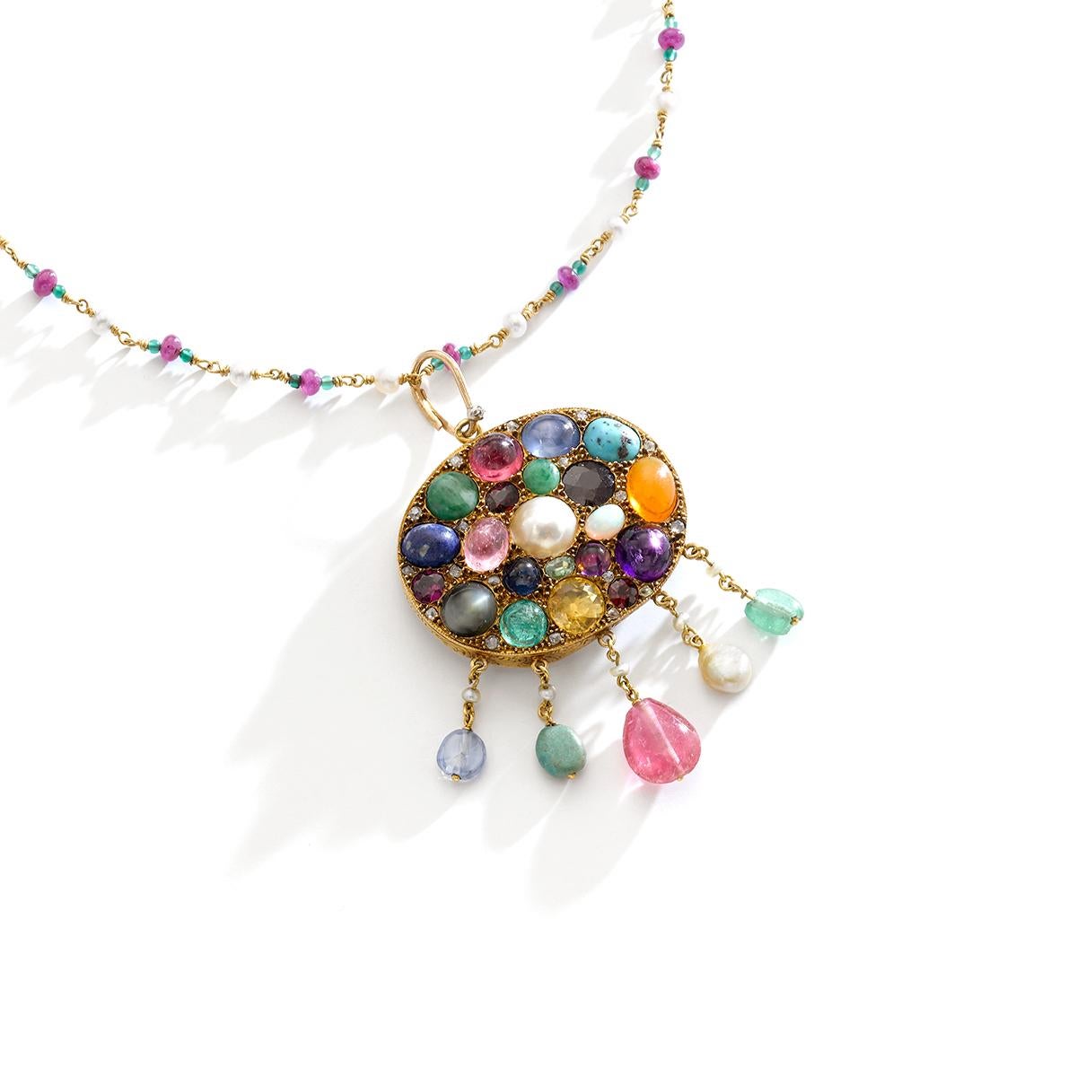 Multi Gems cabochon, Mother of Pearl and small diamond on Gold Pendant chain Necklace.
Emerald, Sapphire, Ruby, Turquoise Matrix, Amethyst, Pearl, Opal, Citrine, Peridot, Garnet, Diamond.
Mid 20th Century.

Size of the pendant:
Total height: 2.95