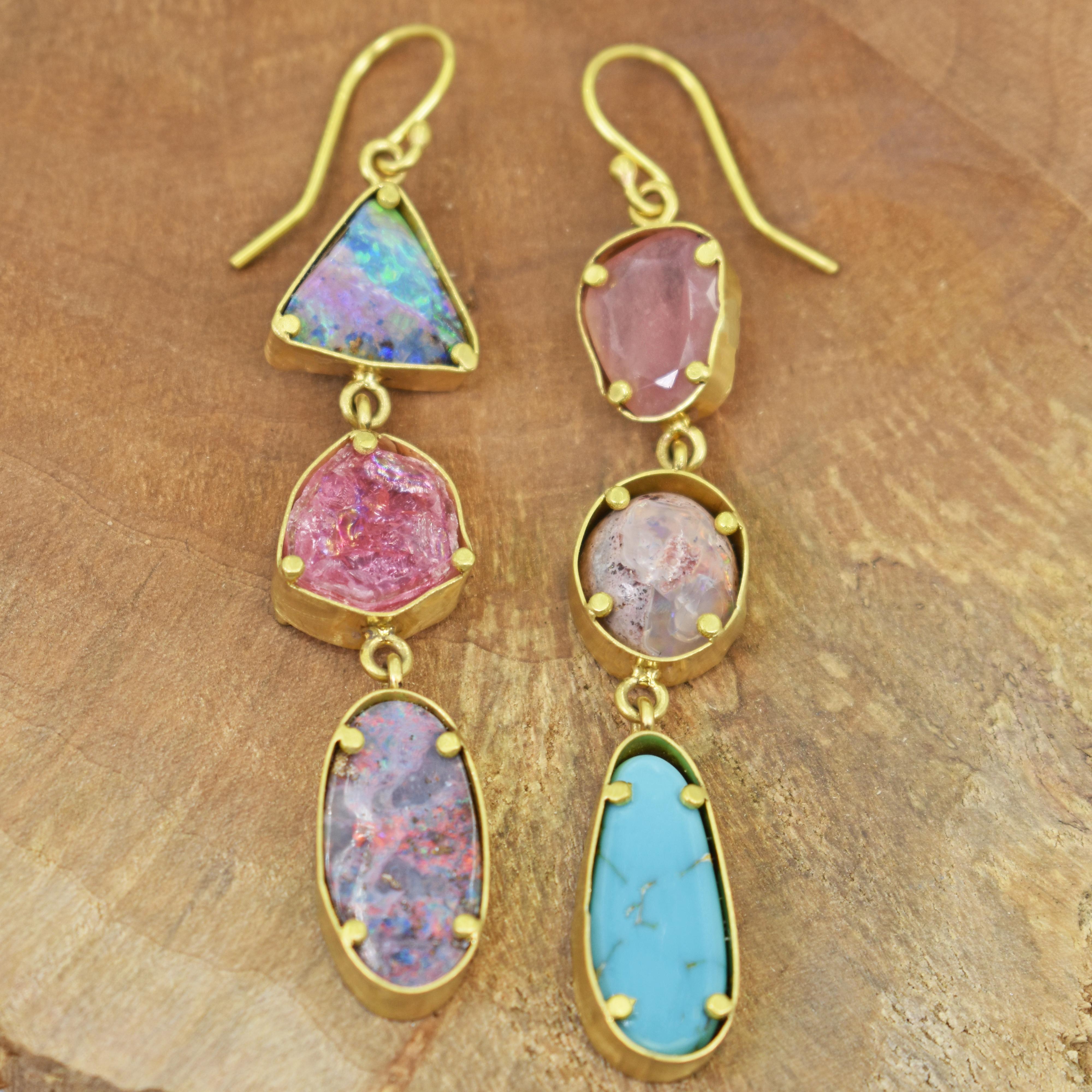 One-of-a-kind, gorgeous multi-gemstone 22k yellow gold asymmetrical dangle earrings. Gemstones include Australian Boulder Opal, Pink Tourmaline Slice, Rhodolite Garnet, Mexican Opal and Arizona Turquoise. Dangle earrings, including ear wires, are 3