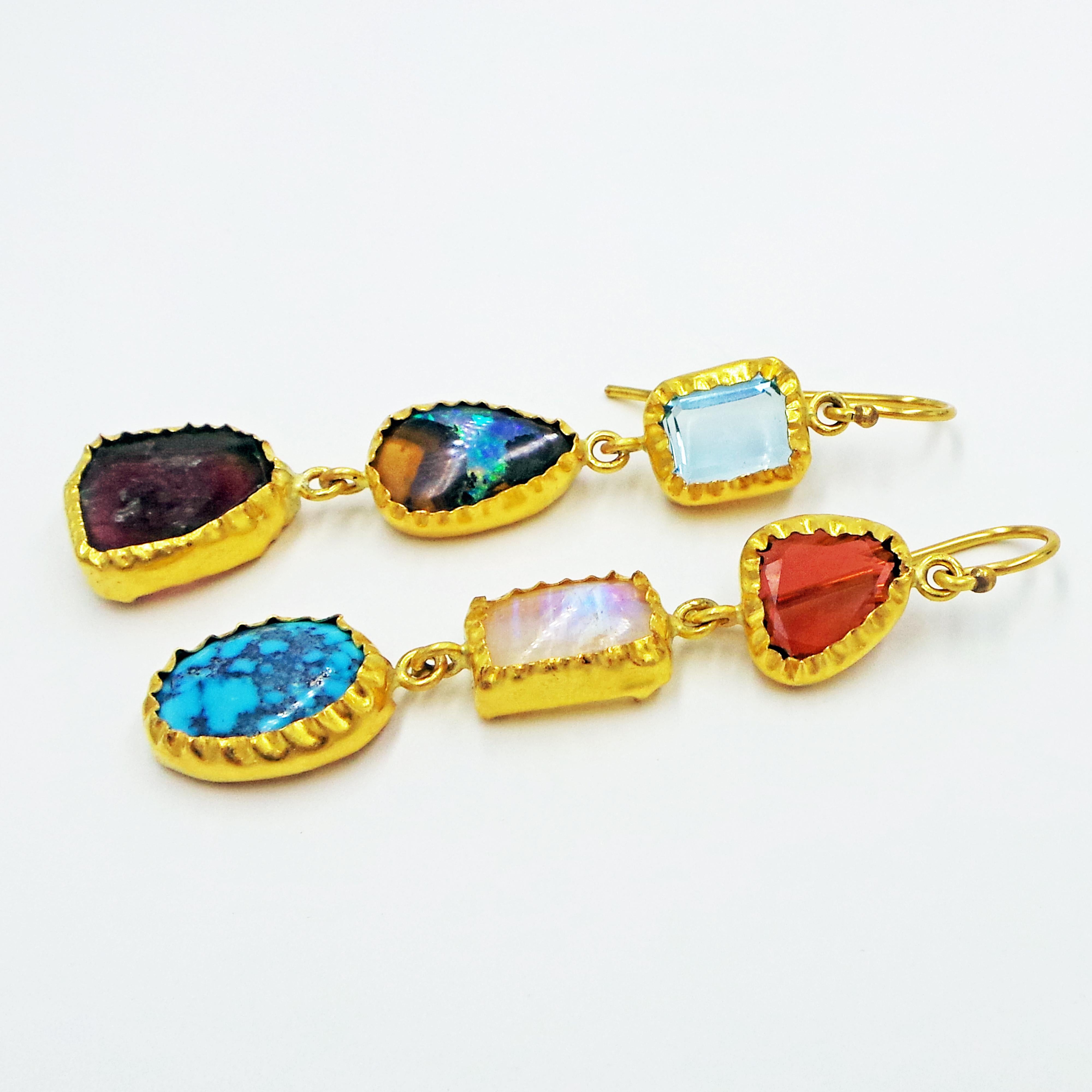 Gorgeous, one-of-a-kind multi-gemstone dangle earrings wrapped in 22k yellow gold. Gemstones include Aquamarine, Australian Boulder Opal, Russian Watermelon Tourmaline slice, Garnet, Moonstone and Kingman Turquoise. Unique, lively, and colorful pair