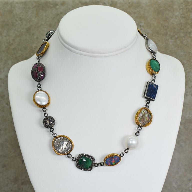 Multi-gemstone and ancient coin two-tone sterling silver and 24k yellow gold link necklace. Link necklace is made of 16 unique pieces including Freshwater Button Pearls, Malachite, Kyanite slice, Ruby, raw Diamond, authentic ancient Greek silver