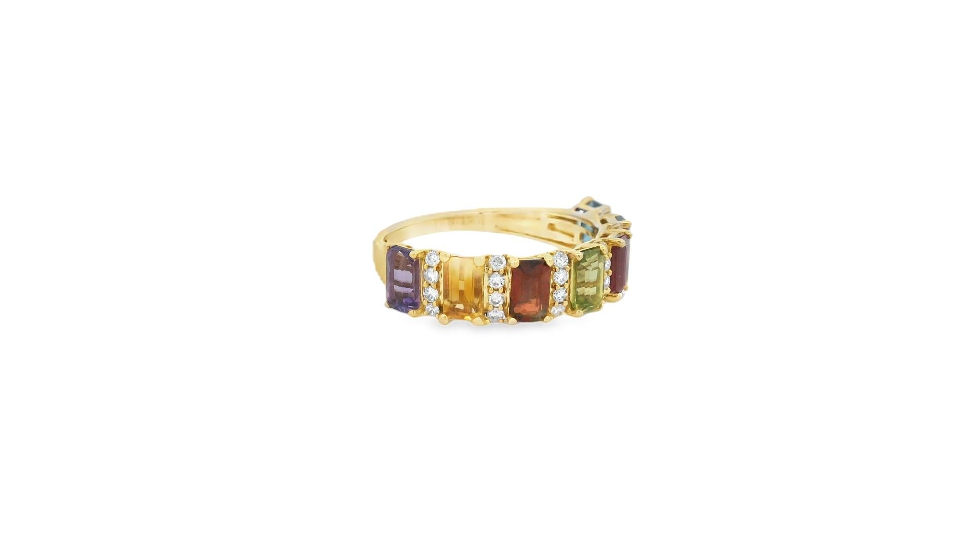 Colorful and luminous, this rainbow gemstone and diamond band ring showcases a curated spectrum of seven emerald-cut stones — each flanked by round diamond accents — in rich 10K yellow gold. With a combined total carat weight of 2.37, the piece