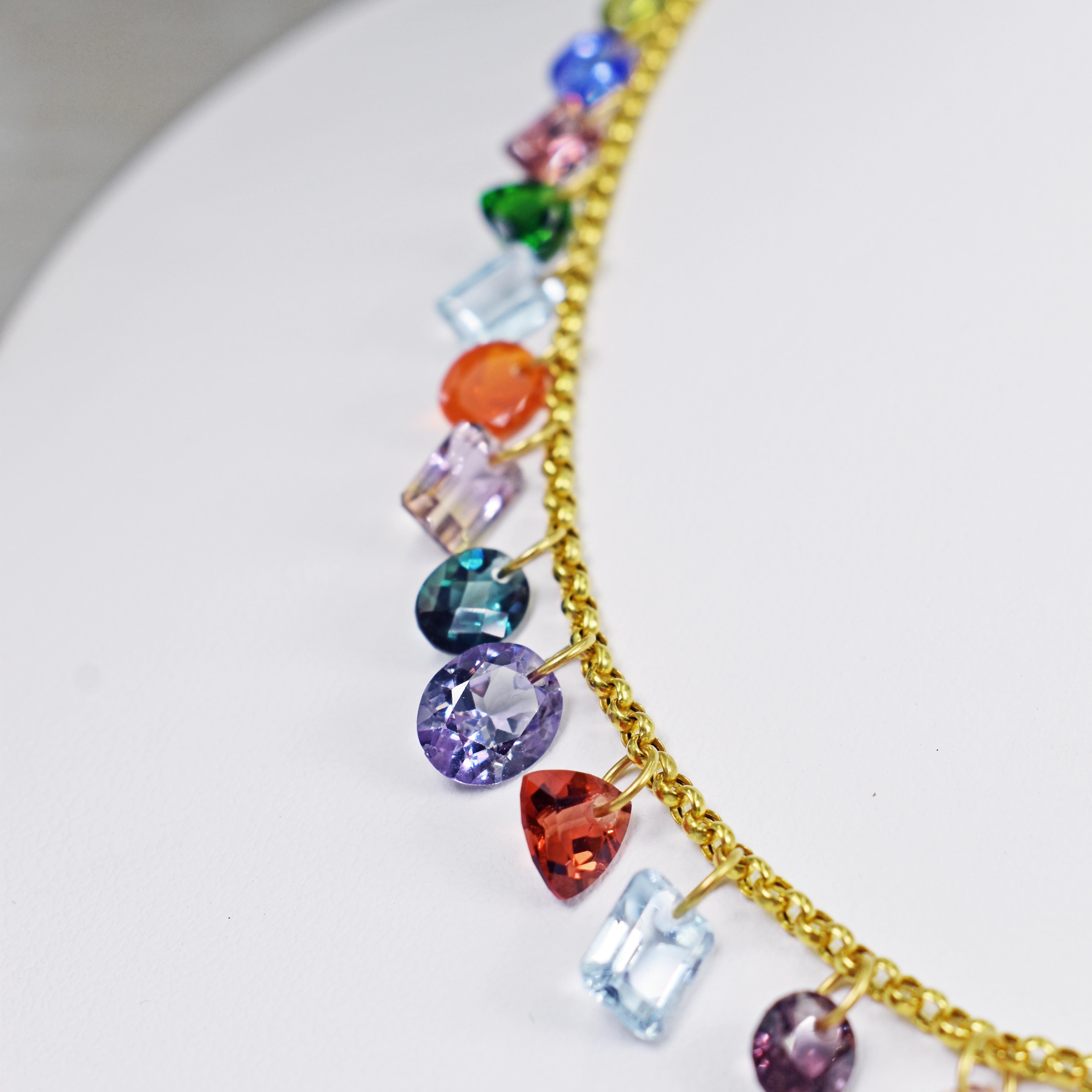 One-of-a-kind, colorful multi-gemstone charms on 22k yellow gold Rolo chain necklace. Gemstones in this necklace include Peridot, Tanzanite, Diopside, Garnet, Aquamarine, Fire Opal, Ametrine, Topaz, Color-Change Lab Sapphire, Morganite, Citrine,
