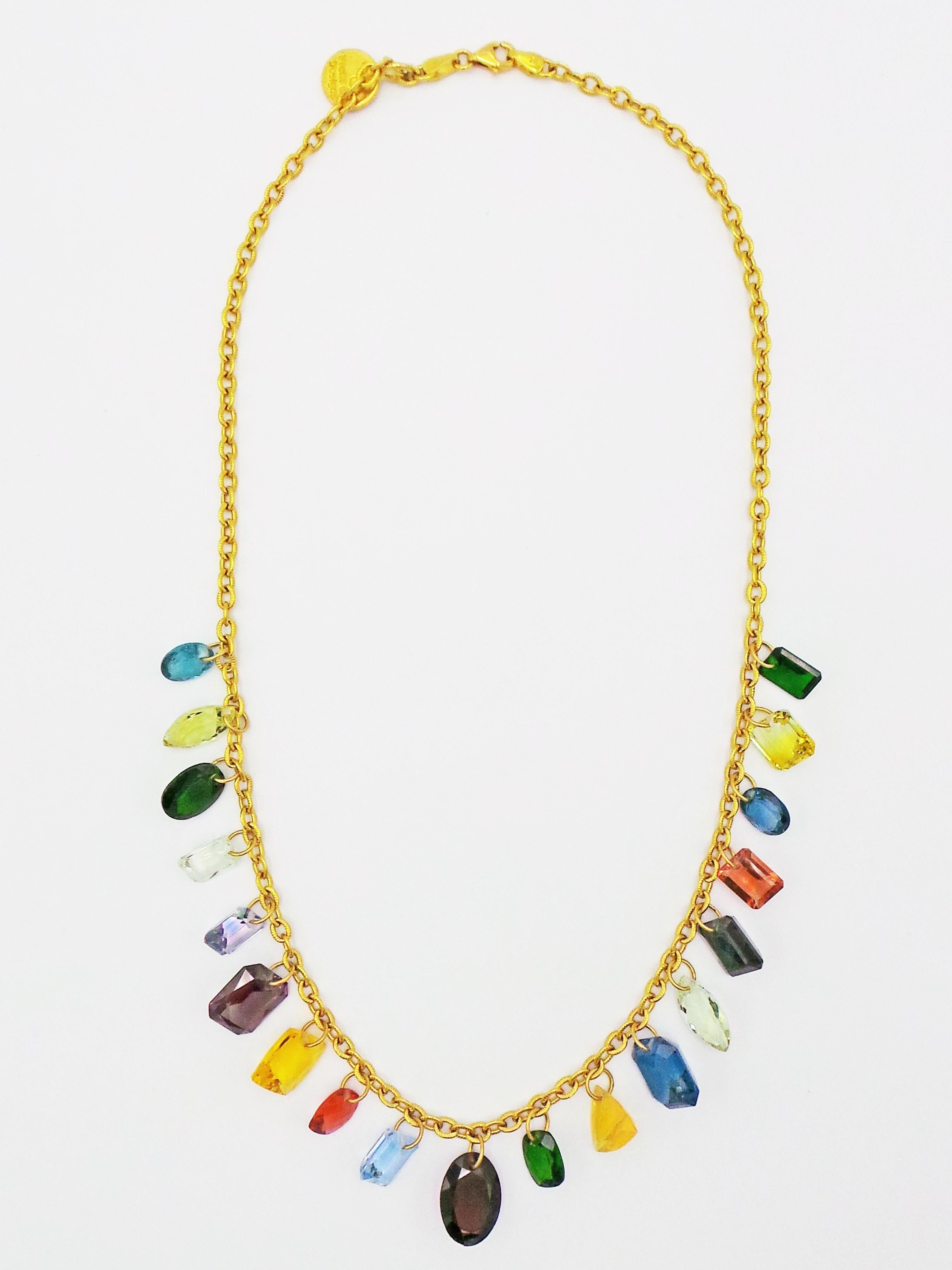 One-of-a-kind, multiple gemstone charms linked on a 22k yellow gold cable chain necklace. There are nineteen drilled gem charms in this necklace including: Topaz, Zircon, Aquamarine, Peridot, Lab-created Alexandrite, Fire Opal, Citrine, Labradorite,