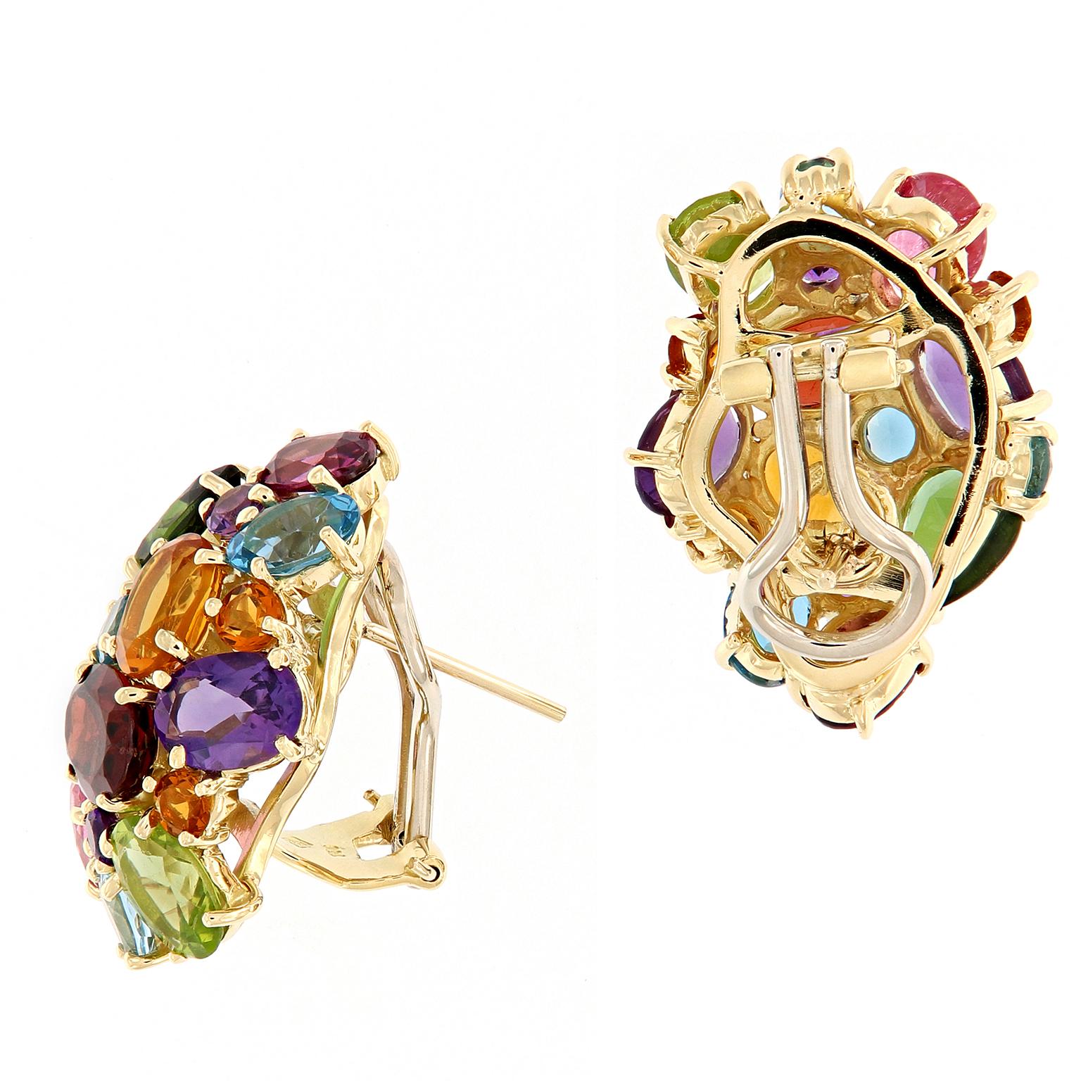 Truly a stunning display of color! These “party” earrings feature a multi-color cluster of amethyst, citrine, peridot, garnet, and topaz set in 18k yellow gold. These post earrings feature omega backs
Weigh 18.2 grams.