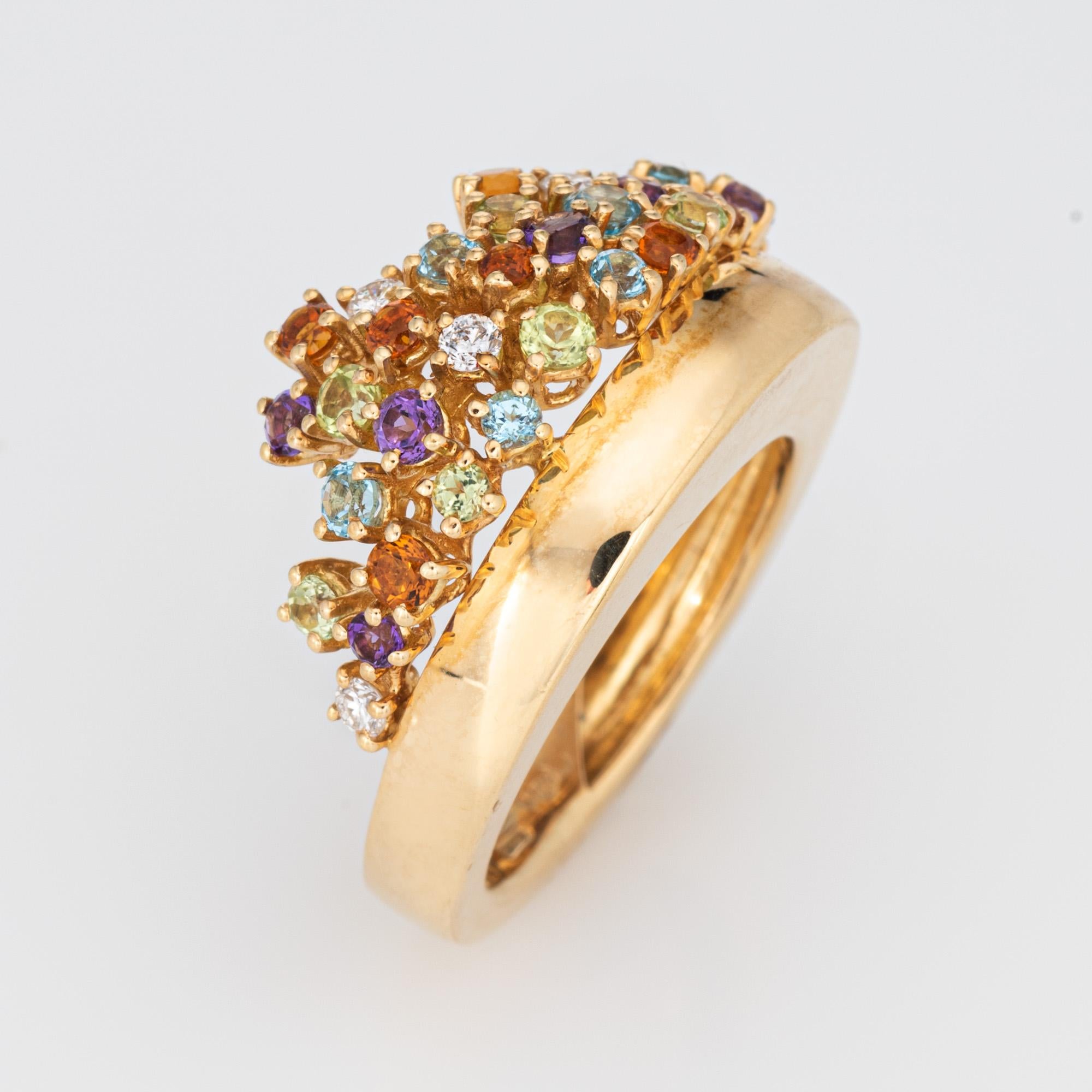 Stylish multi gemstone confetti ring crafted in 18 karat yellow gold. 

Semi-precious gemstones (citrine, blue topaz, amethyst and peridot). Diamonds total an estimated 0.25 carats (estimated at H-I color and SI1 clarity). The stones are in very