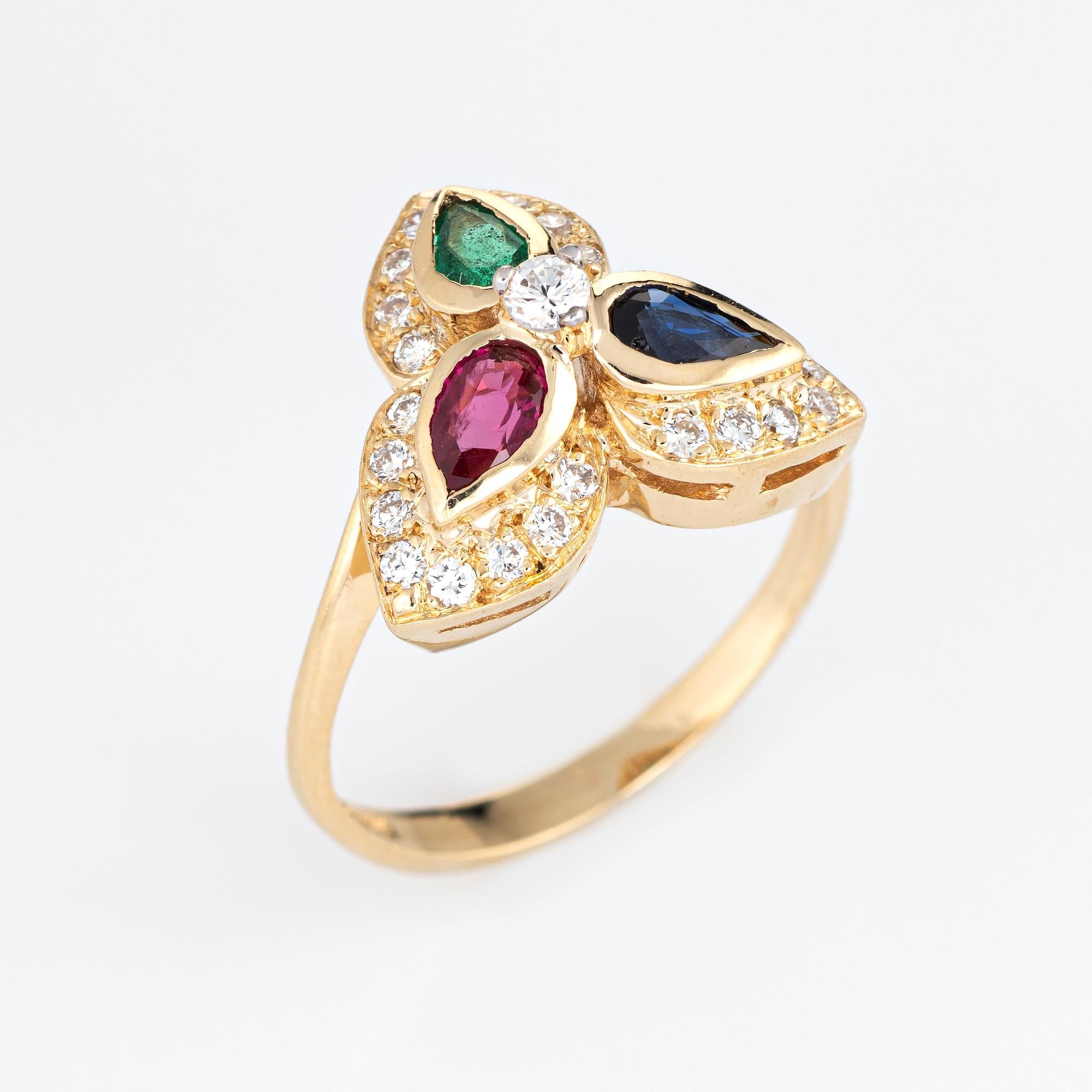 Stylish vintage gemstone & diamond cocktail ring crafted in 14 karat yellow gold. 

Pear cut emerald, sapphire & ruby measure 5mm x 2.5mm each (estimated at 0.15 carats each - 0.45 carats total estimated weight). The diamonds total an estimated 0.53
