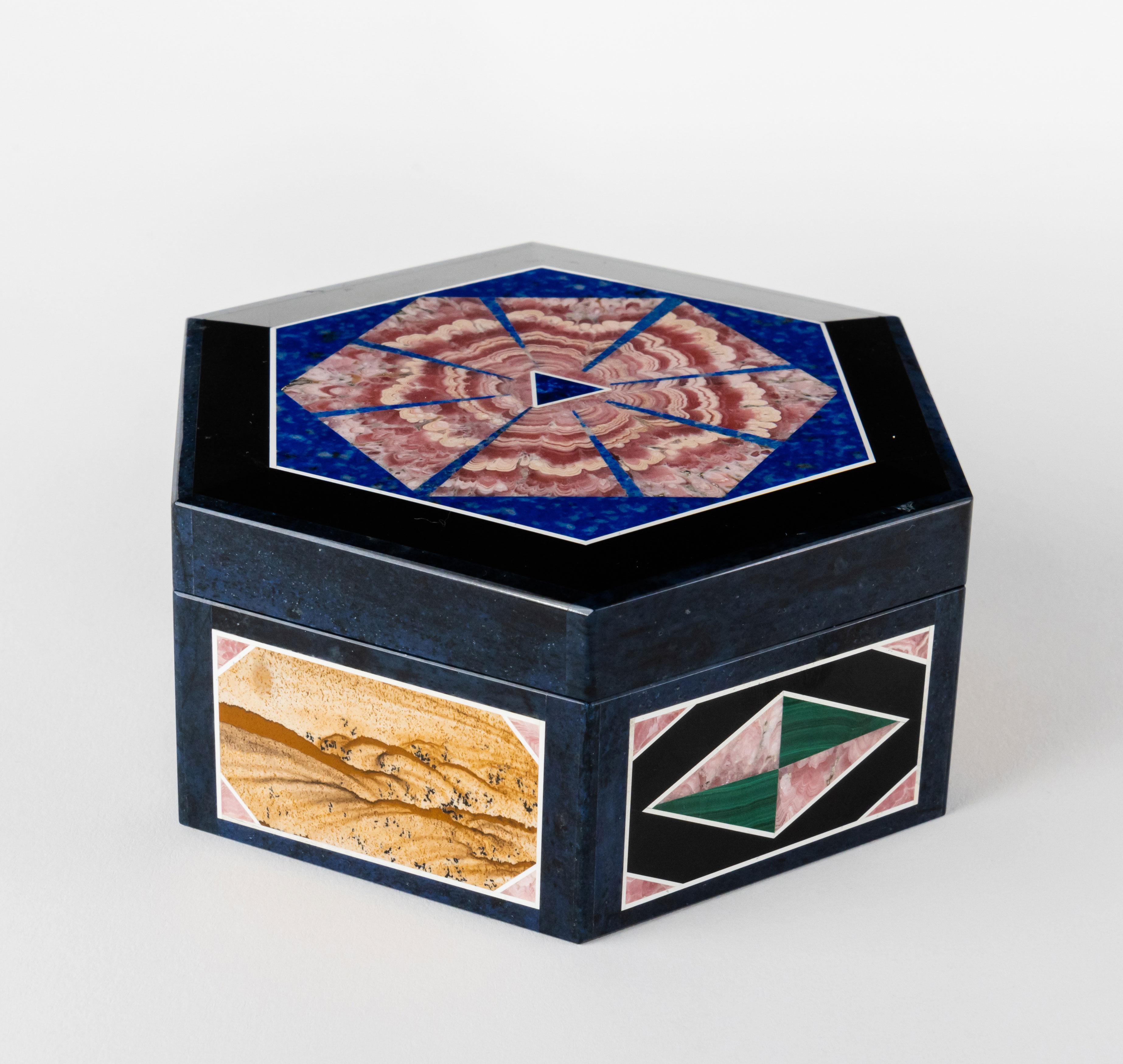 Exceptional Russian multi-Gemstone Intarsia jewelry box. This beautiful box was made out of malachite, petrified wood, lapis lazuli, mother of pearl, black onyx & rhodonite.

Measures: D: 4-1/2
