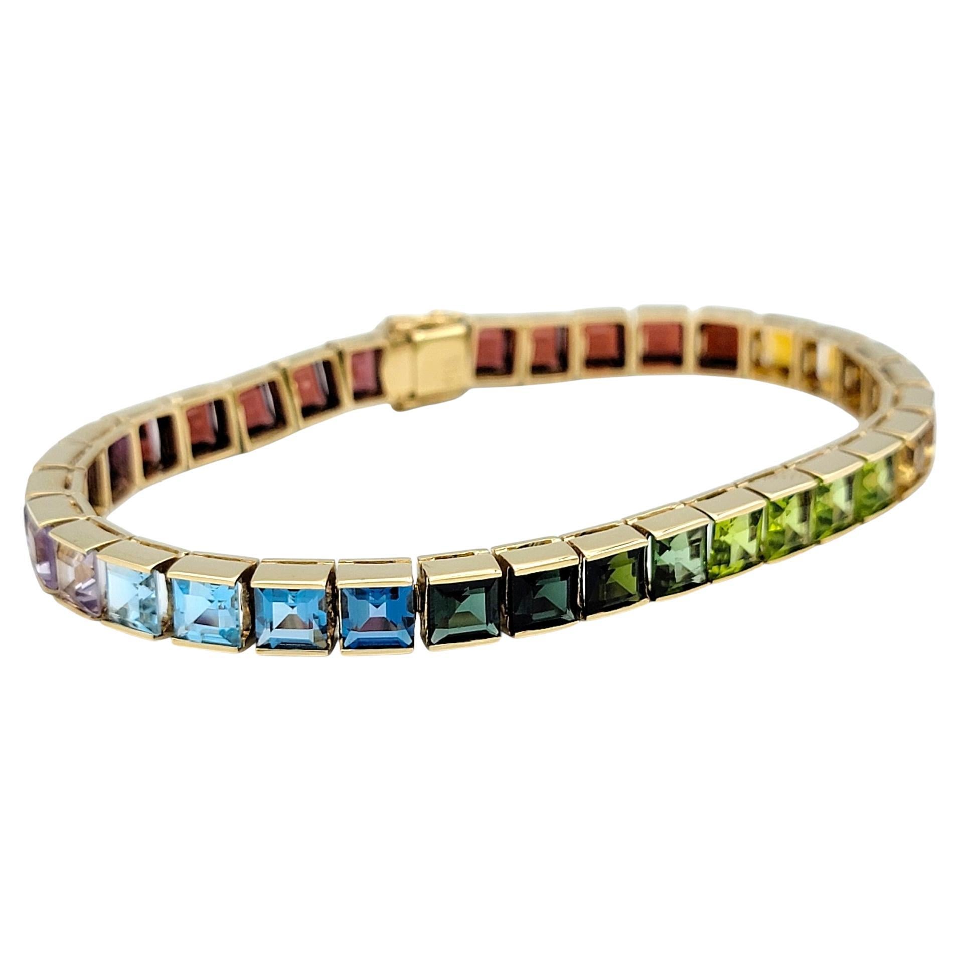 Step into a world of vibrant elegance with this rainbow gemstone tennis bracelet, a masterpiece of color and craftsmanship. Featuring an exquisite gradient of dazzling gemstones, this bracelet effortlessly transitions through a stunning rainbow