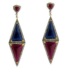 Boucles d'oreilles pendantes en forme de losange avec diamants en or 18k et argent