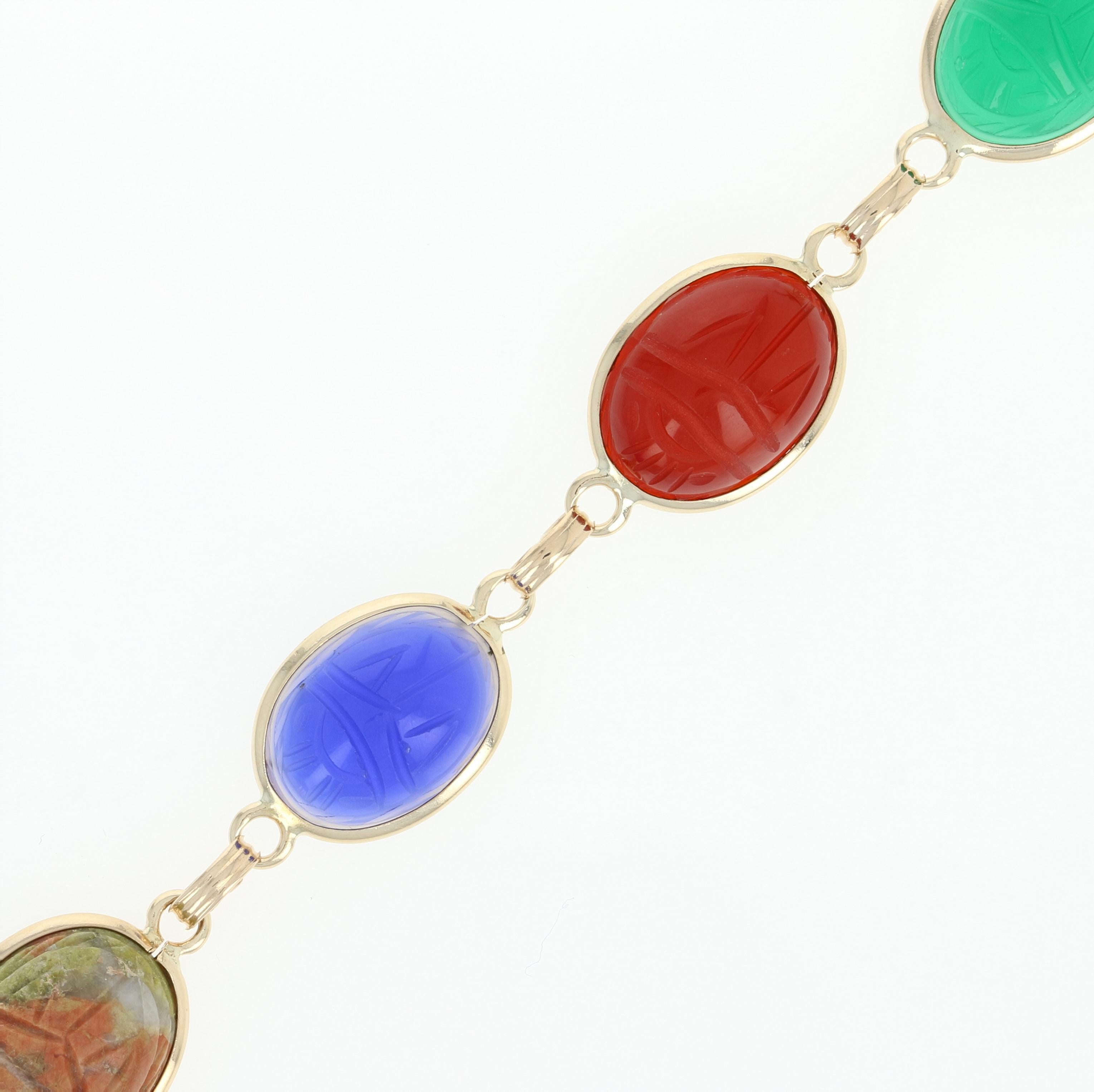 If you adore ancient Egyptian history and style, this gorgeous piece is destined to become a treasured addition to your jewelry collection! This 14k yellow gold link bracelet showcases six genuine gemstones that display brilliant hues and are each