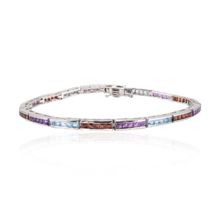 Beautifully handcrafted silver Multi Gemstone Sleek Tennis Bracelet, designed with love, including handpicked luxury gemstones for each designer piece. Grab the spotlight with this exquisitely crafted piece. Inlaid with natural multi sapphire